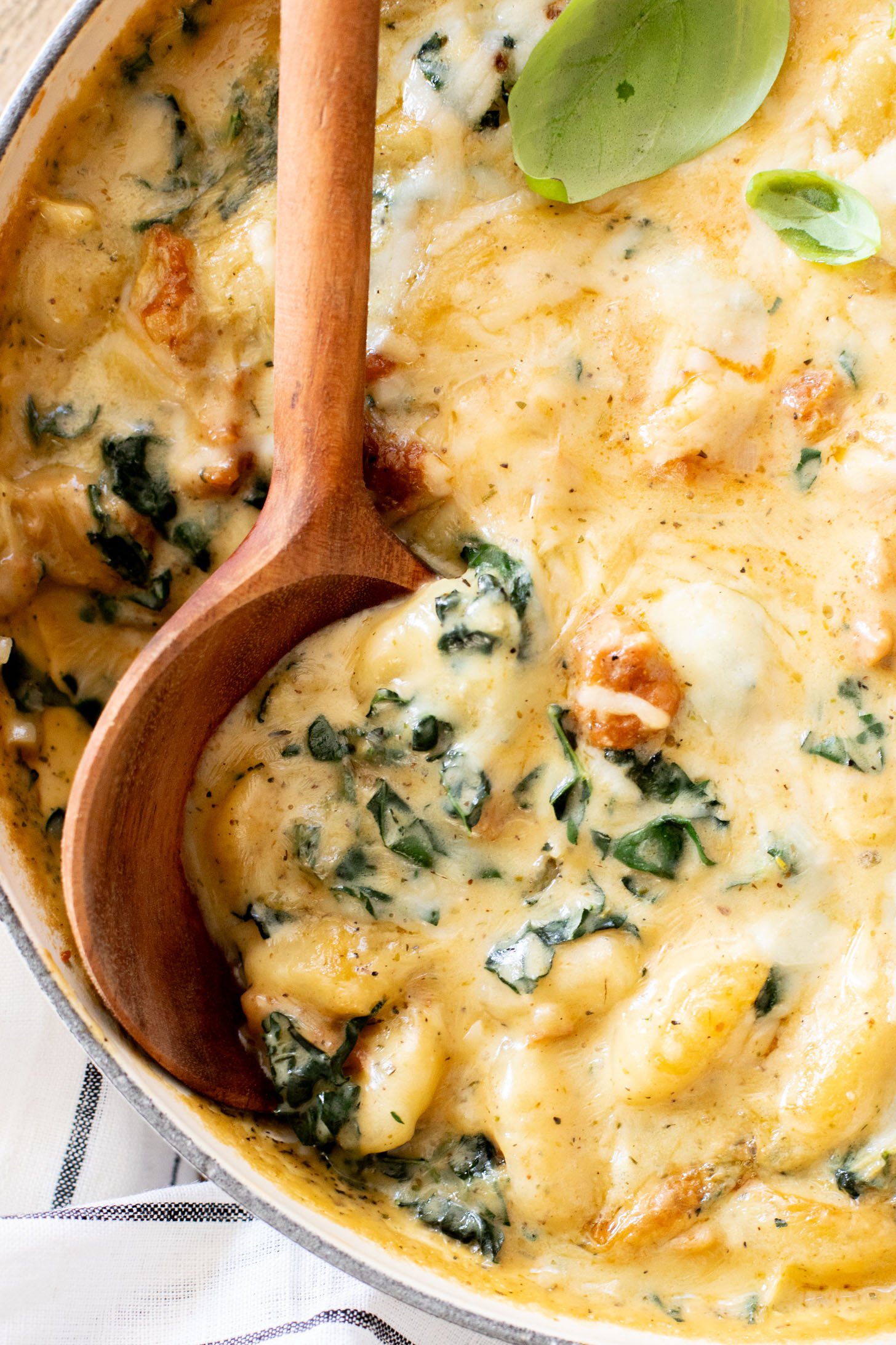 This Vegan Baked Sausage & Kale Gnocchi is a cheesy, comfort food dish. Made in one pot and baked until hot & bubbly | ThisSavoryVegan.com