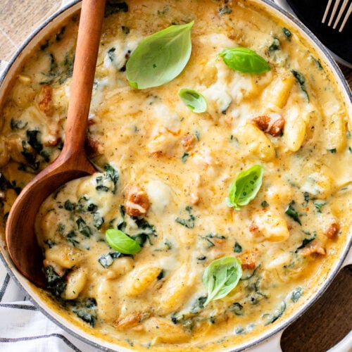 This Vegan Baked Sausage & Kale Gnocchi is a cheesy, comfort food dish. Made in one pot and baked until hot & bubbly | ThisSavoryVegan.com