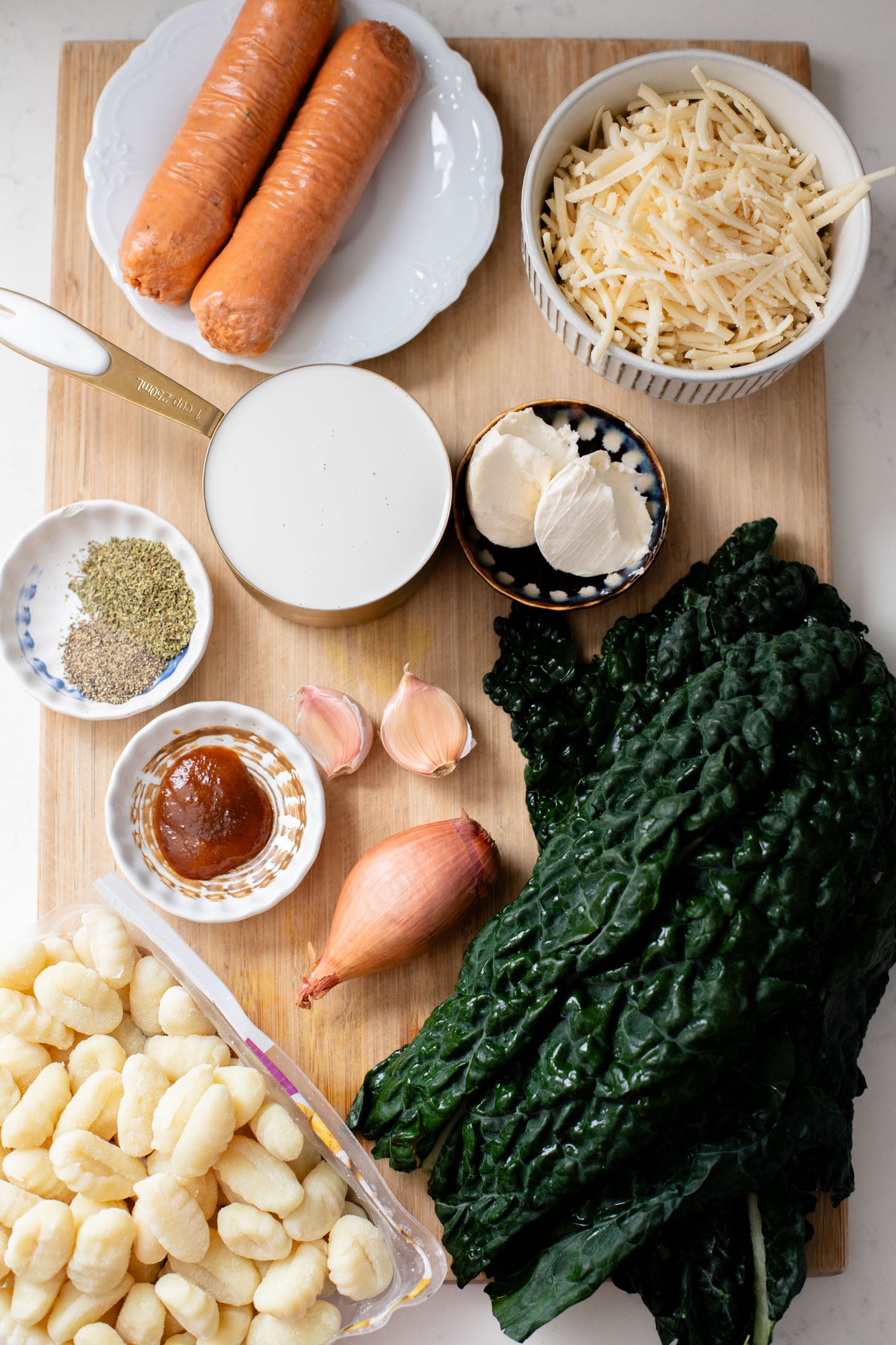 This Vegan Baked Sausage & Kale Gnocchi is a cheesy, comfort food dish. Made in one pot and baked until hot & bubbly | ThisSavoryVegan.com