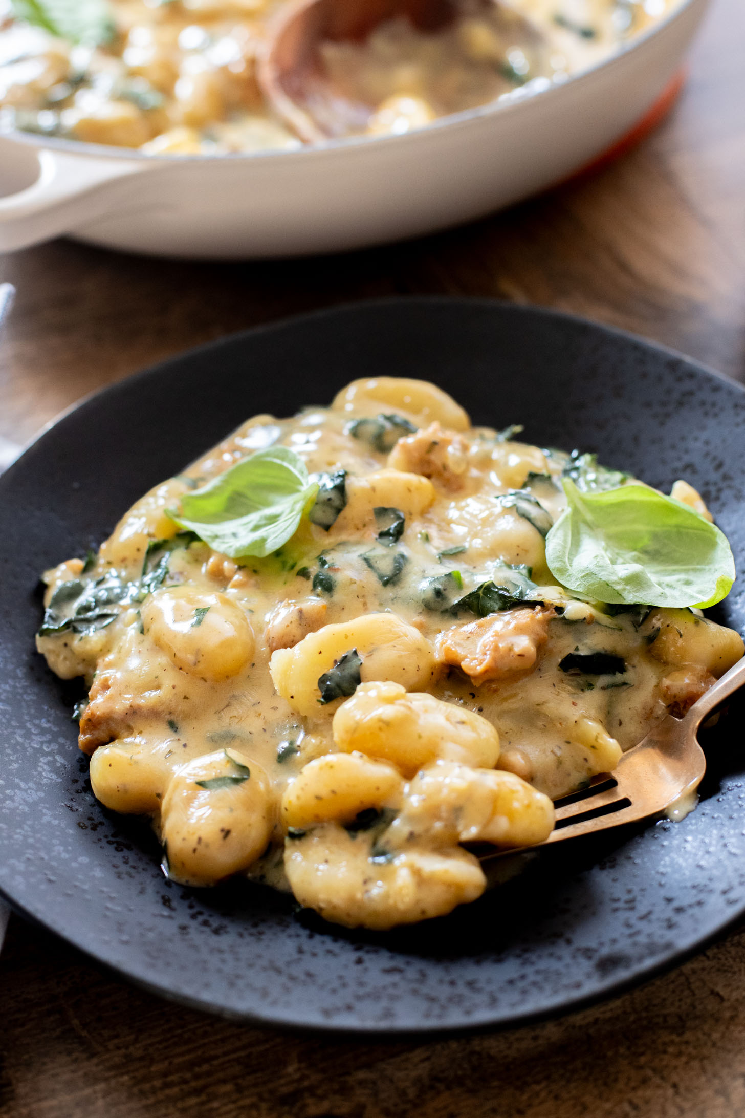 This Vegan Baked Sausage & Kale Gnocchi is a cheesy, comfort food dish. Made in one pot and baked until hot & bubbly | ThisSavoryVegan.com