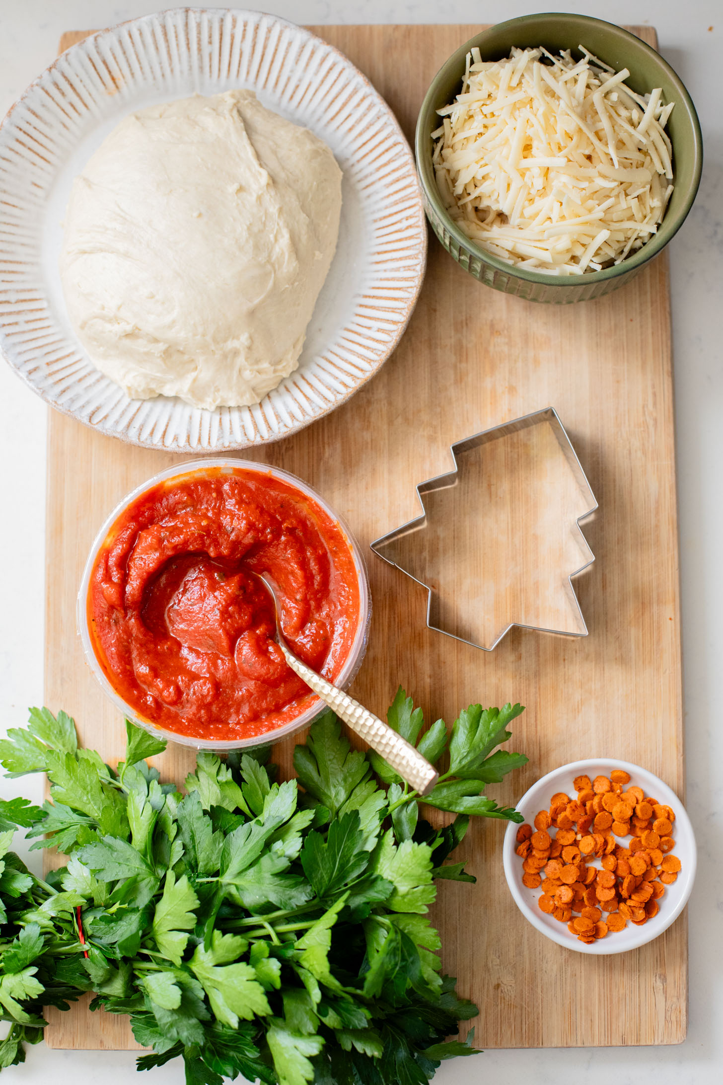 These Mini Christmas Tree Pizzas are a festive holiday recipe that are fun to make and taste amazing | ThisSavoryVegan.com