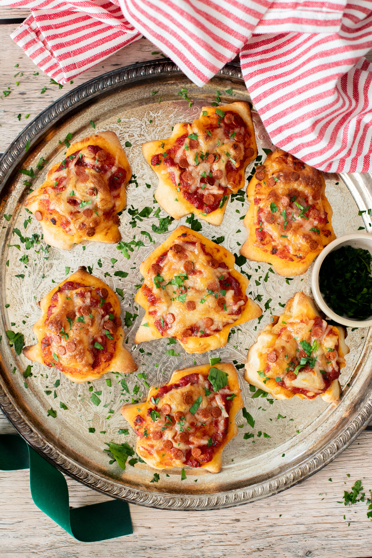 These Mini Christmas Tree Pizzas are a festive holiday recipe that are fun to make and taste amazing | ThisSavoryVegan.com