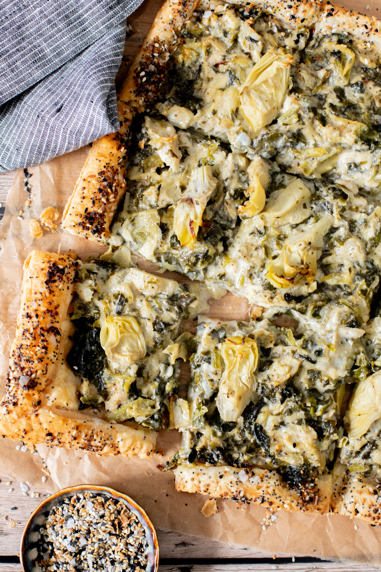 This Spinach Artichoke Tart is a holiday appetizer must make! It is dairy-free and ready in no time - perfect for a party | ThisSavoryVegan.com