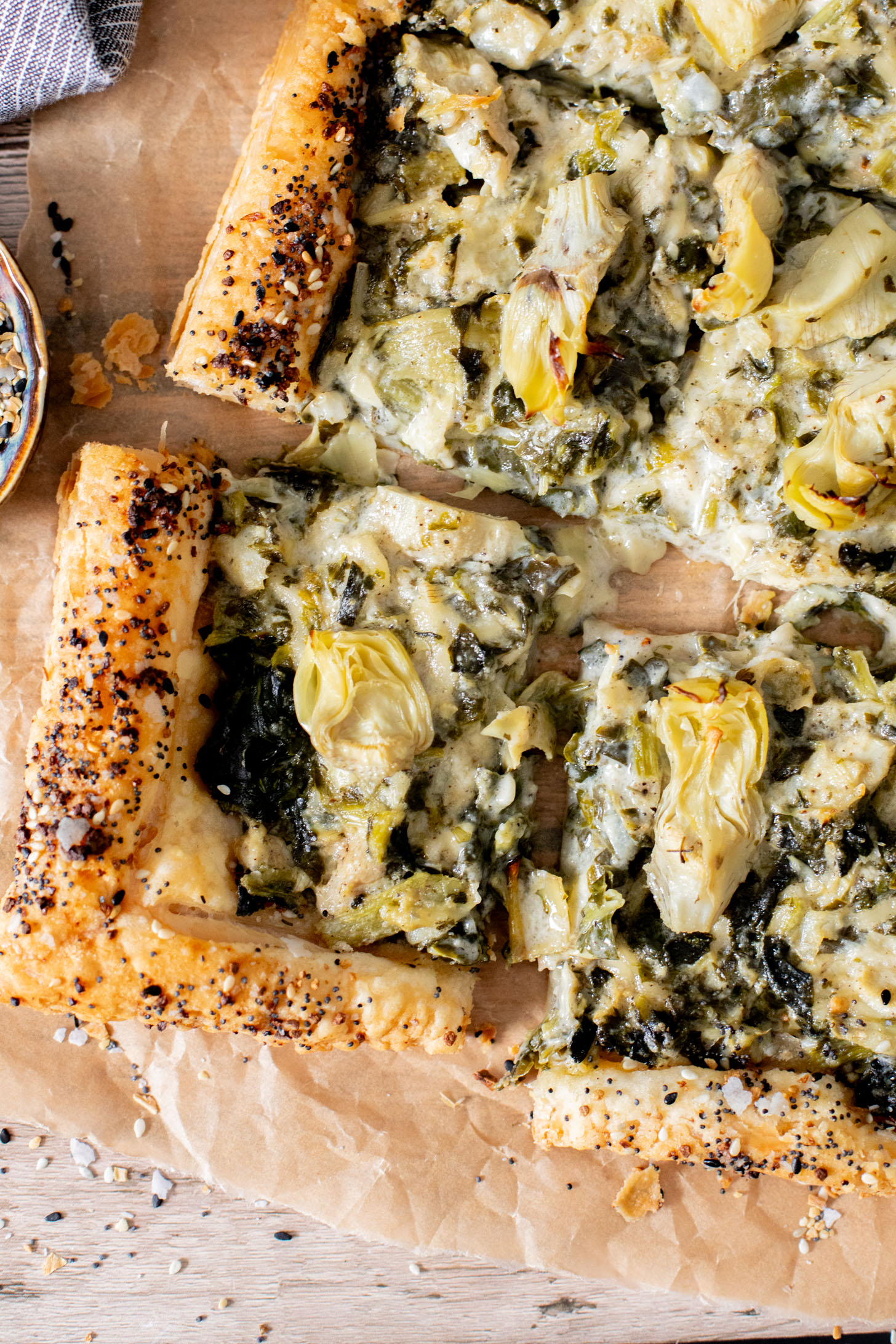 This Spinach Artichoke Tart is a holiday appetizer must make! It is dairy-free and ready in no time - perfect for a party | ThisSavoryVegan.com