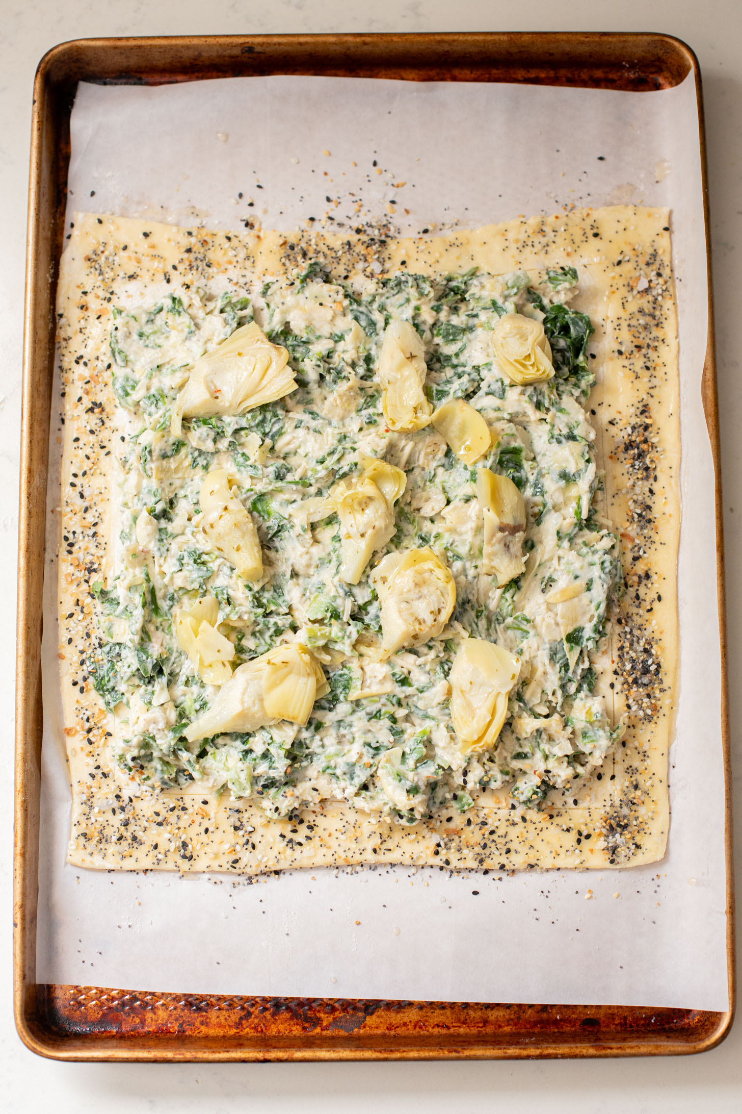 This Spinach Artichoke Tart is a holiday appetizer must make! It is dairy-free and ready in no time - perfect for a party | ThisSavoryVegan.com