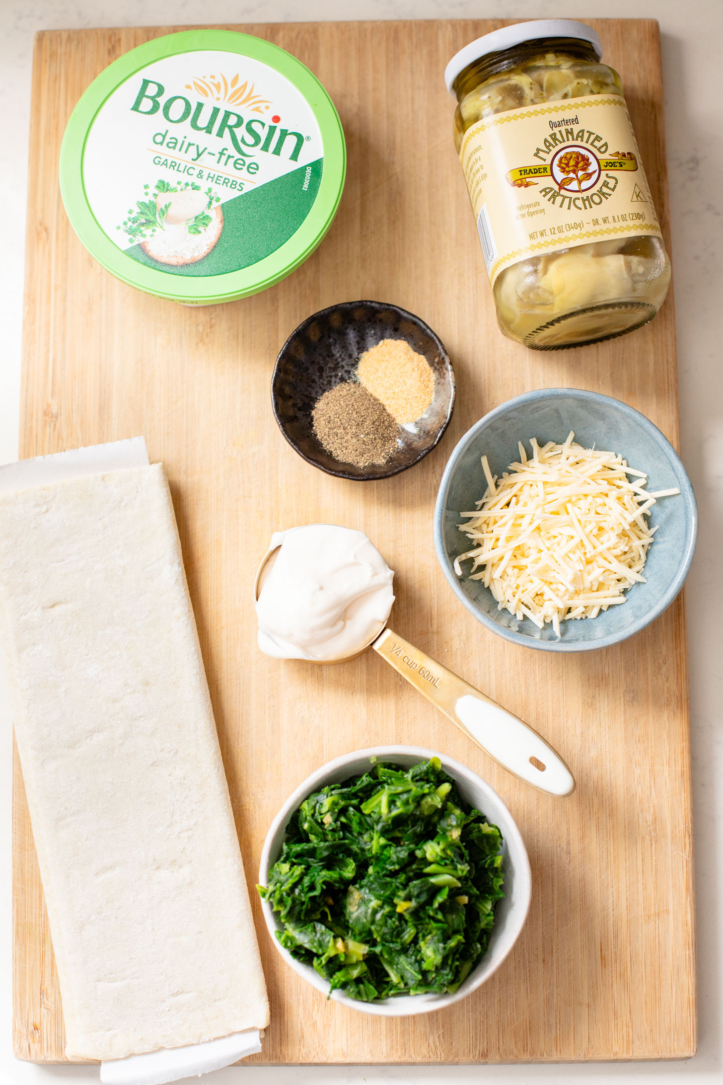 This Spinach Artichoke Tart is a holiday appetizer must make! It is dairy-free and ready in no time - perfect for a party | ThisSavoryVegan.com