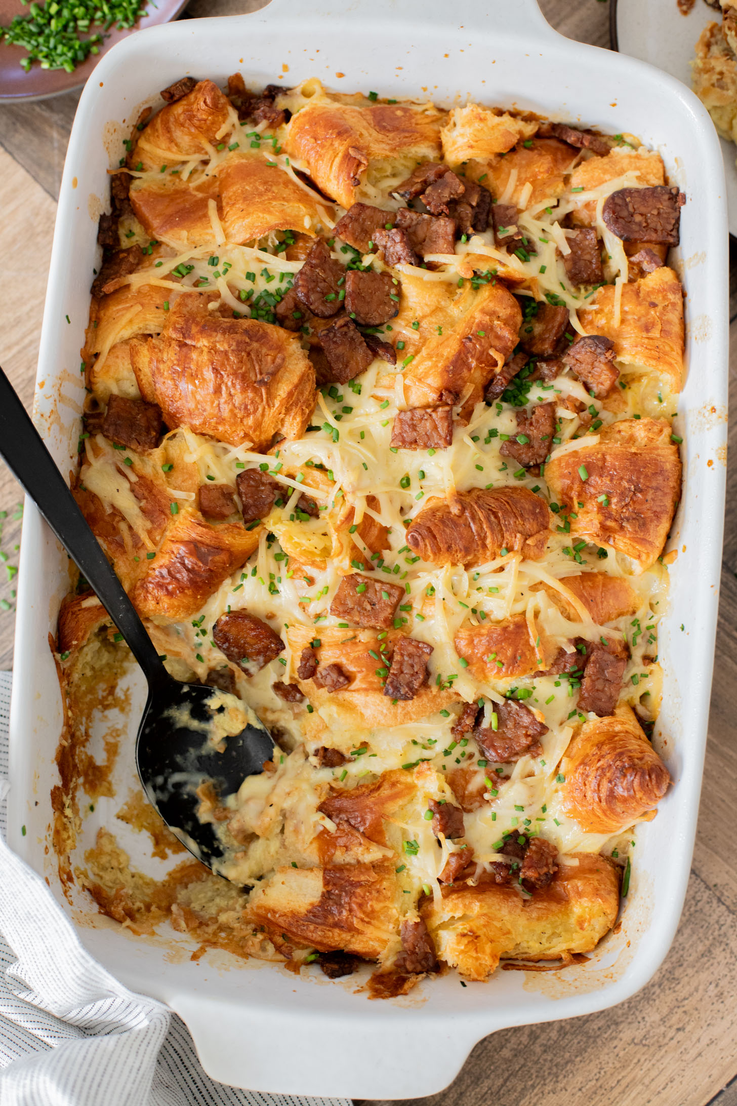 This Vegan Croissant Breakfast Casserole is made with flakey vegan croissants, tempeh bacon and vegan eggs | ThisSavoryVegan.com