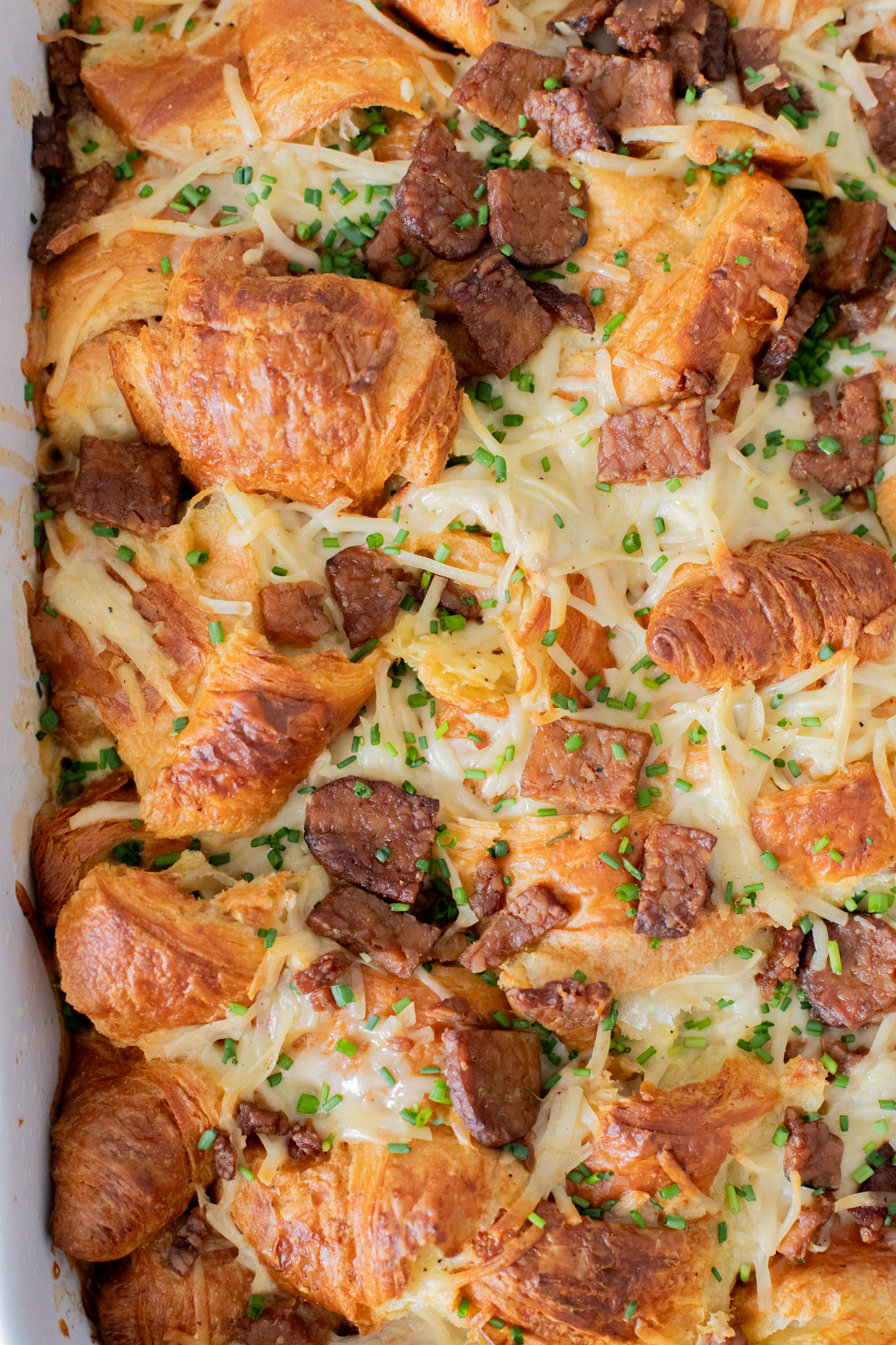 This Vegan Croissant Breakfast Casserole is made with flakey vegan croissants, tempeh bacon and vegan eggs | ThisSavoryVegan.com