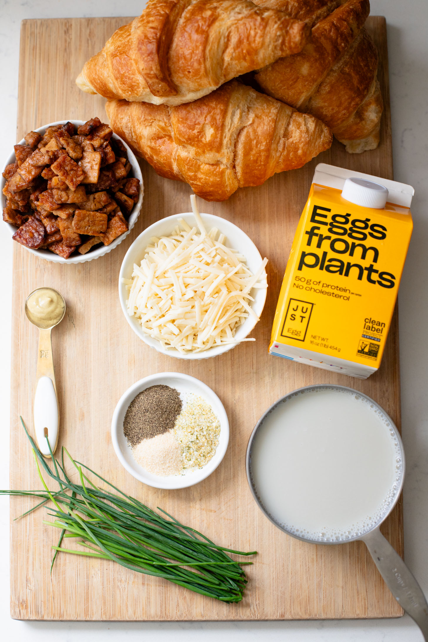 This Vegan Croissant Breakfast Casserole is made with flakey vegan croissants, tempeh bacon and vegan eggs | ThisSavoryVegan.com