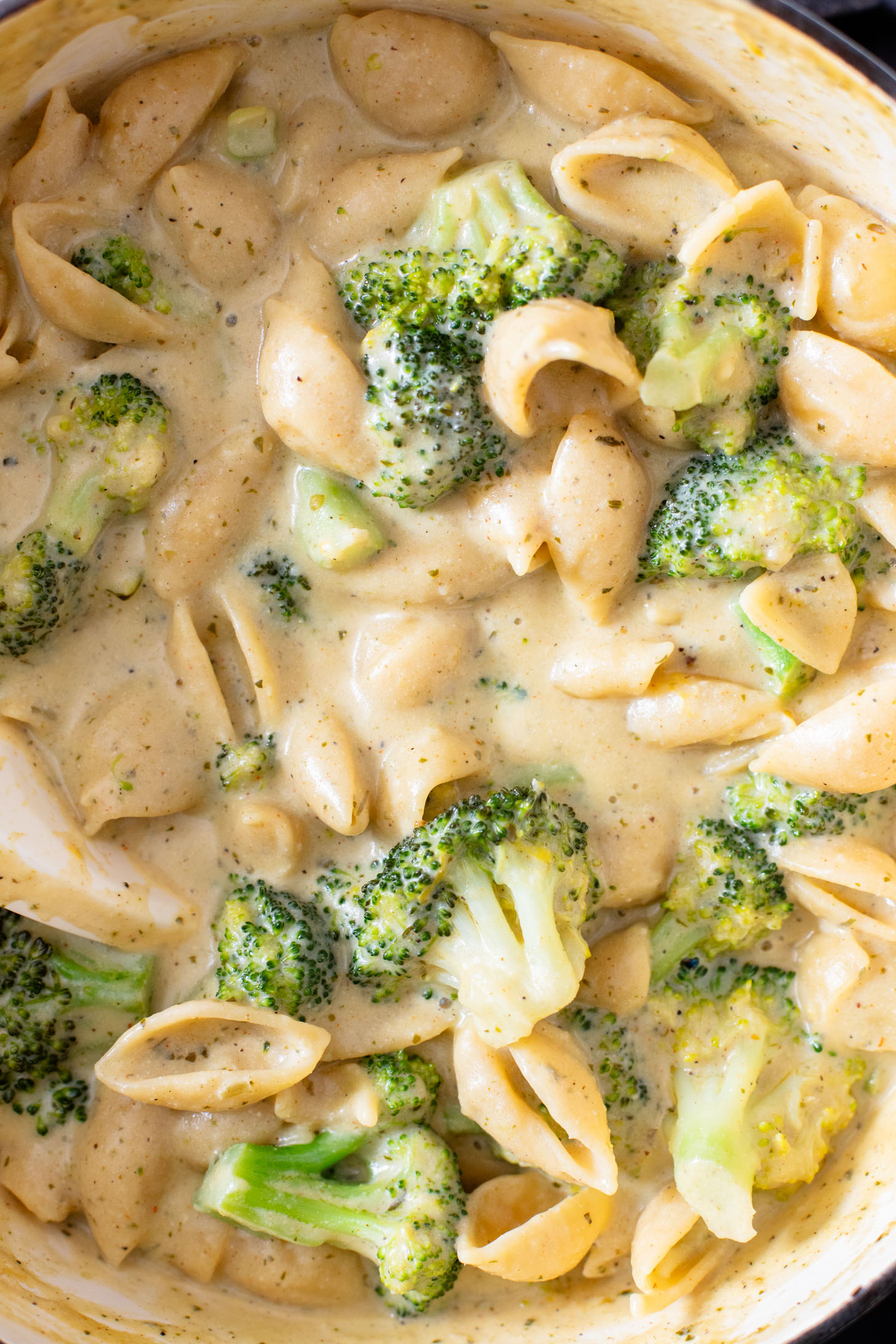 This Creamy Pesto Pasta with Broccoli is not only dairy-free it also has some sneaky protein. Made in one-pot for an easy weeknight dinner | ThisSavoryVegan.com