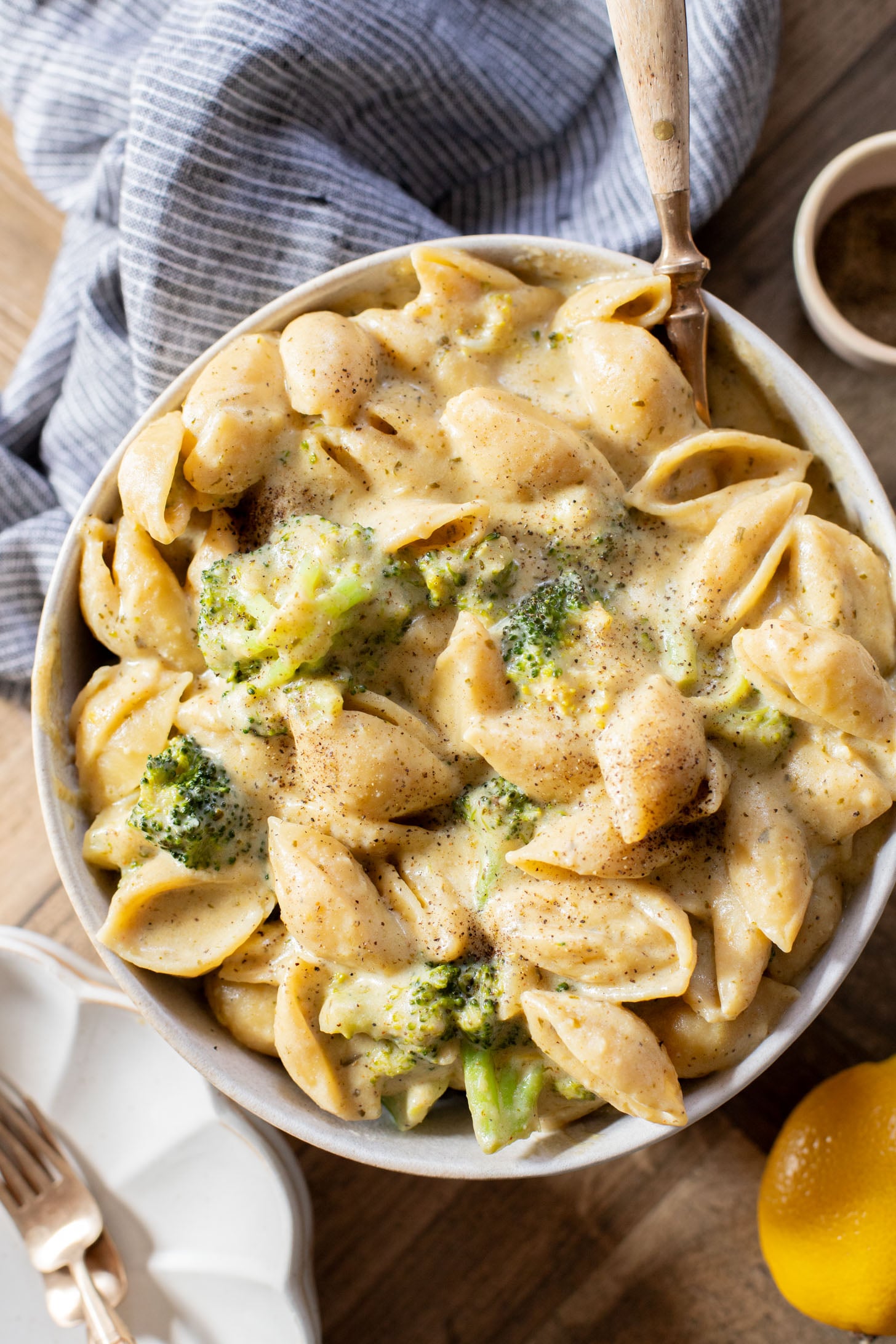 This Creamy Pesto Pasta with Broccoli is not only dairy-free it also has some sneaky protein. Made in one-pot for an easy weeknight dinner | ThisSavoryVegan.com