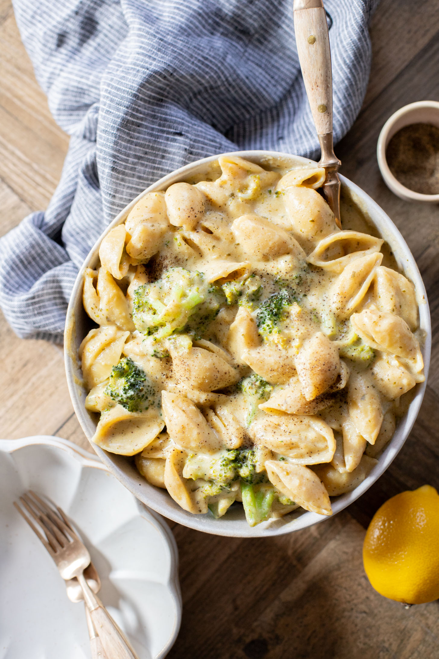 This Creamy Pesto Pasta with Broccoli is not only dairy-free it also has some sneaky protein. Made in one-pot for an easy weeknight dinner | ThisSavoryVegan.com