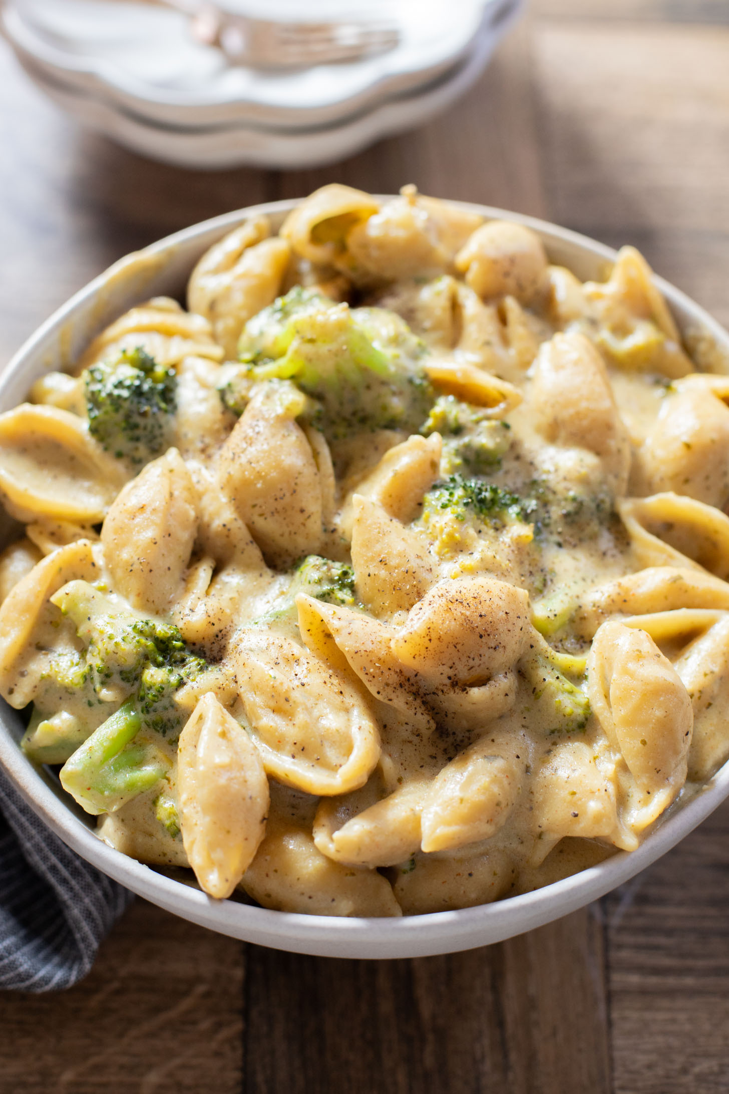 This Creamy Pesto Pasta with Broccoli is not only dairy-free it also has some sneaky protein. Made in one-pot for an easy weeknight dinner | ThisSavoryVegan.com