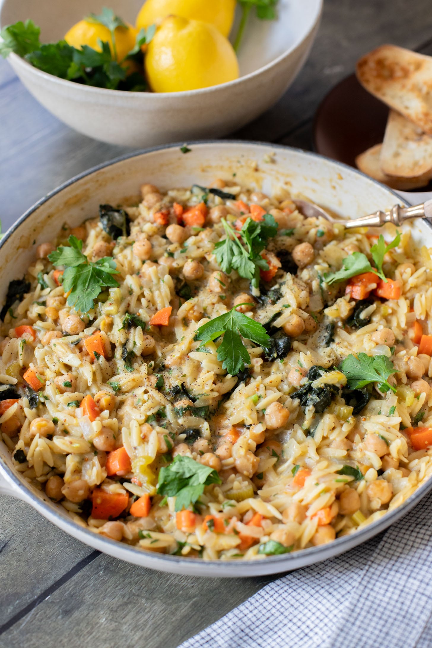 This Lemon Mustard Chickpeas & Orzo recipe is the perfect skillet dinner. Simple flavors like mustard, lemon juice & fresh herbs bring this one together | ThisSavoryVegan.com