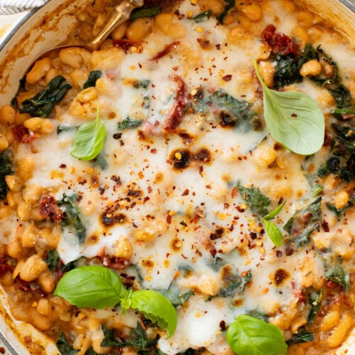 These Mediterranean White Beans are an easy, one-pot dinner that is ready in 30 minutes. Serve with bread for the perfect bite | ThisSavoryVegan.com