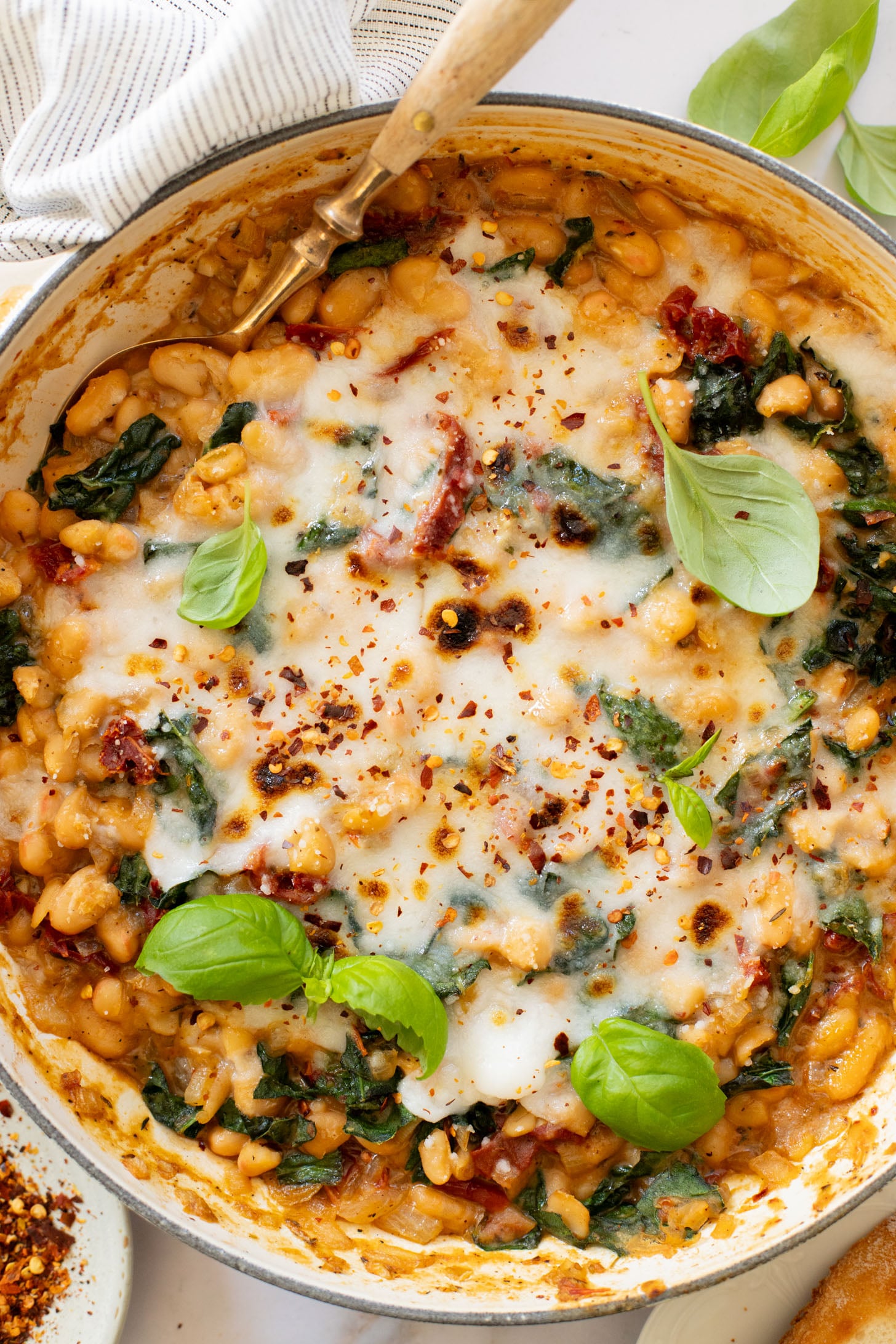 These Mediterranean White Beans are an easy, one-pot dinner that is ready in 30 minutes. Serve with bread for the perfect bite | ThisSavoryVegan.com