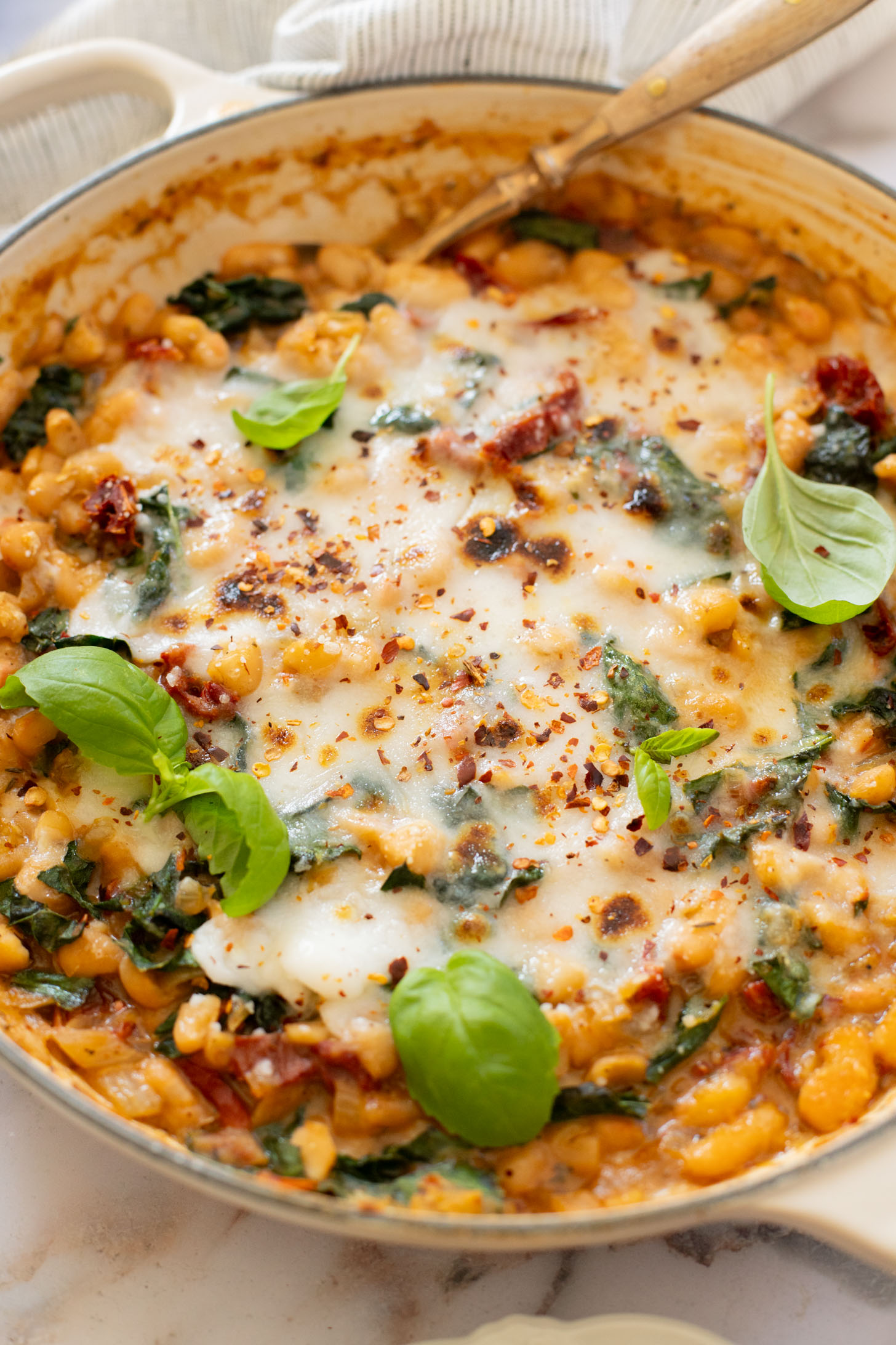 These Mediterranean White Beans are an easy, one-pot dinner that is ready in 30 minutes. Serve with bread for the perfect bite | ThisSavoryVegan.com