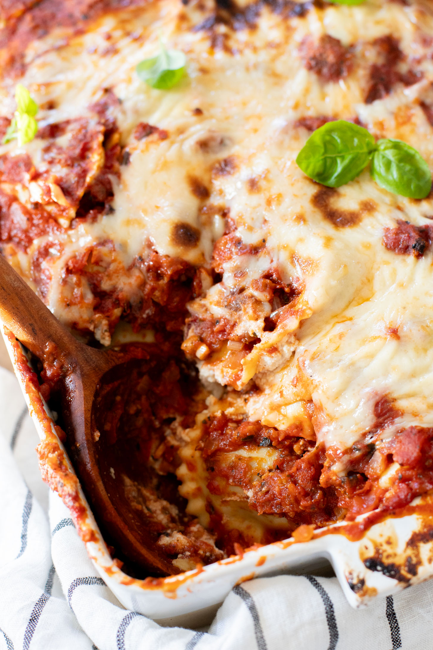 This Ravioli Lasagna is the ultimate family dinner! It is easy to assemble, feeds a crowd and is 100% dairy-free | ThisSavoryVegan.com
