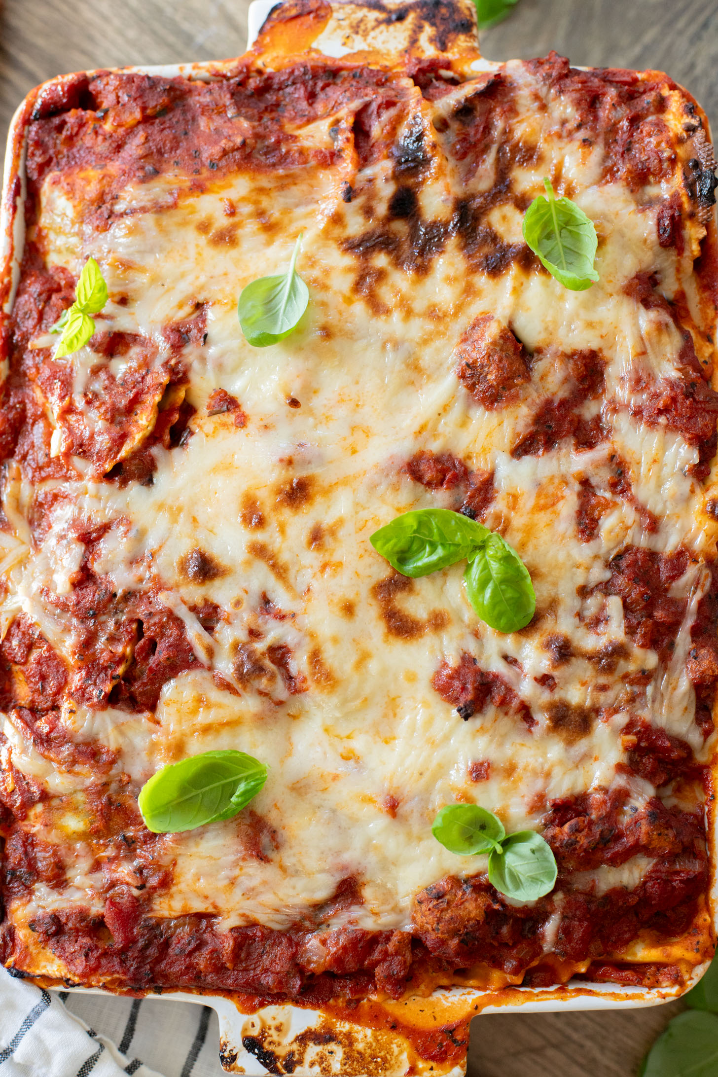 This Ravioli Lasagna is the ultimate family dinner! It is easy to assemble, feeds a crowd and is 100% dairy-free | ThisSavoryVegan.com