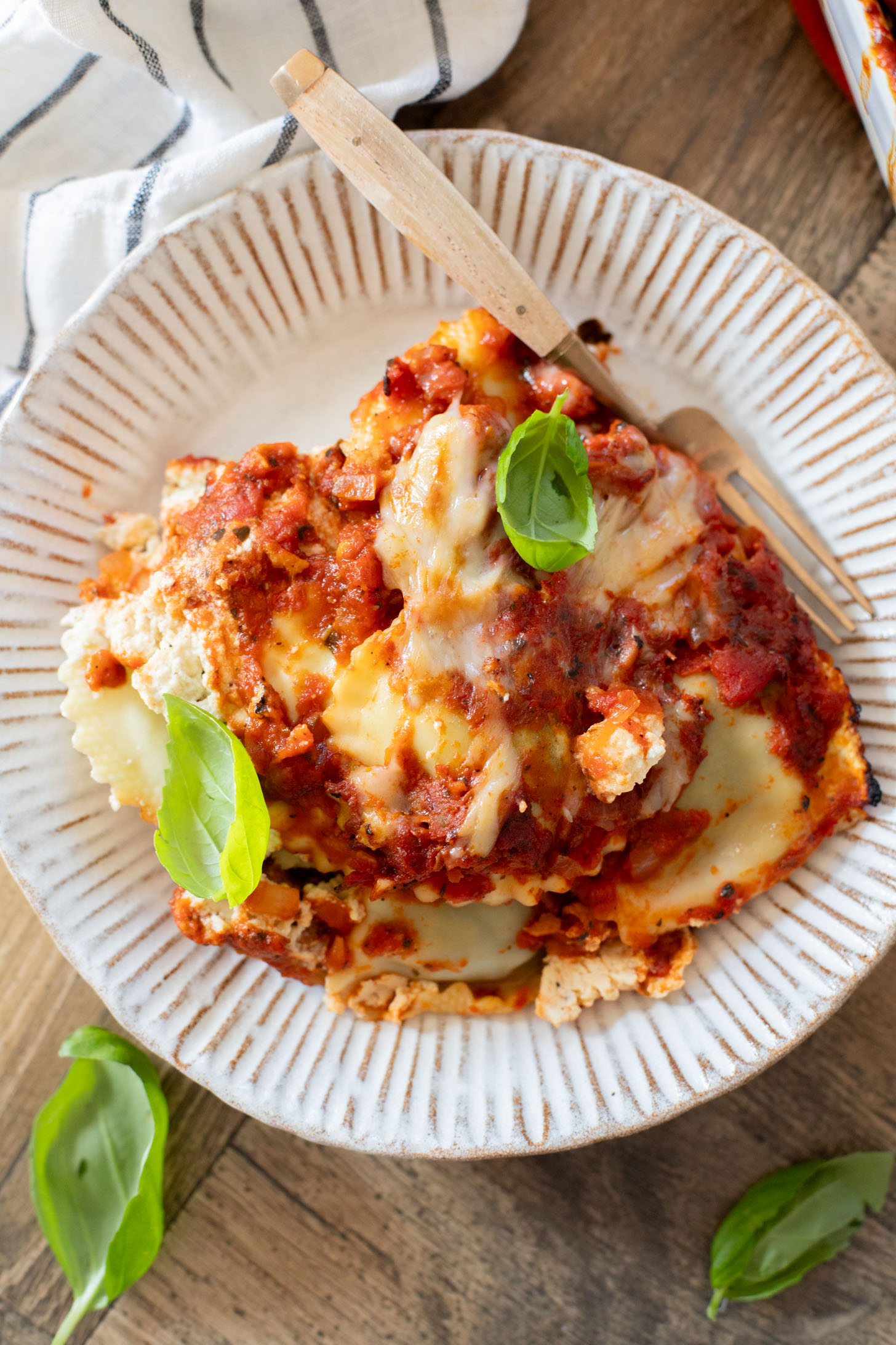 This Ravioli Lasagna is the ultimate family dinner! It is easy to assemble, feeds a crowd and is 100% dairy-free | ThisSavoryVegan.com
