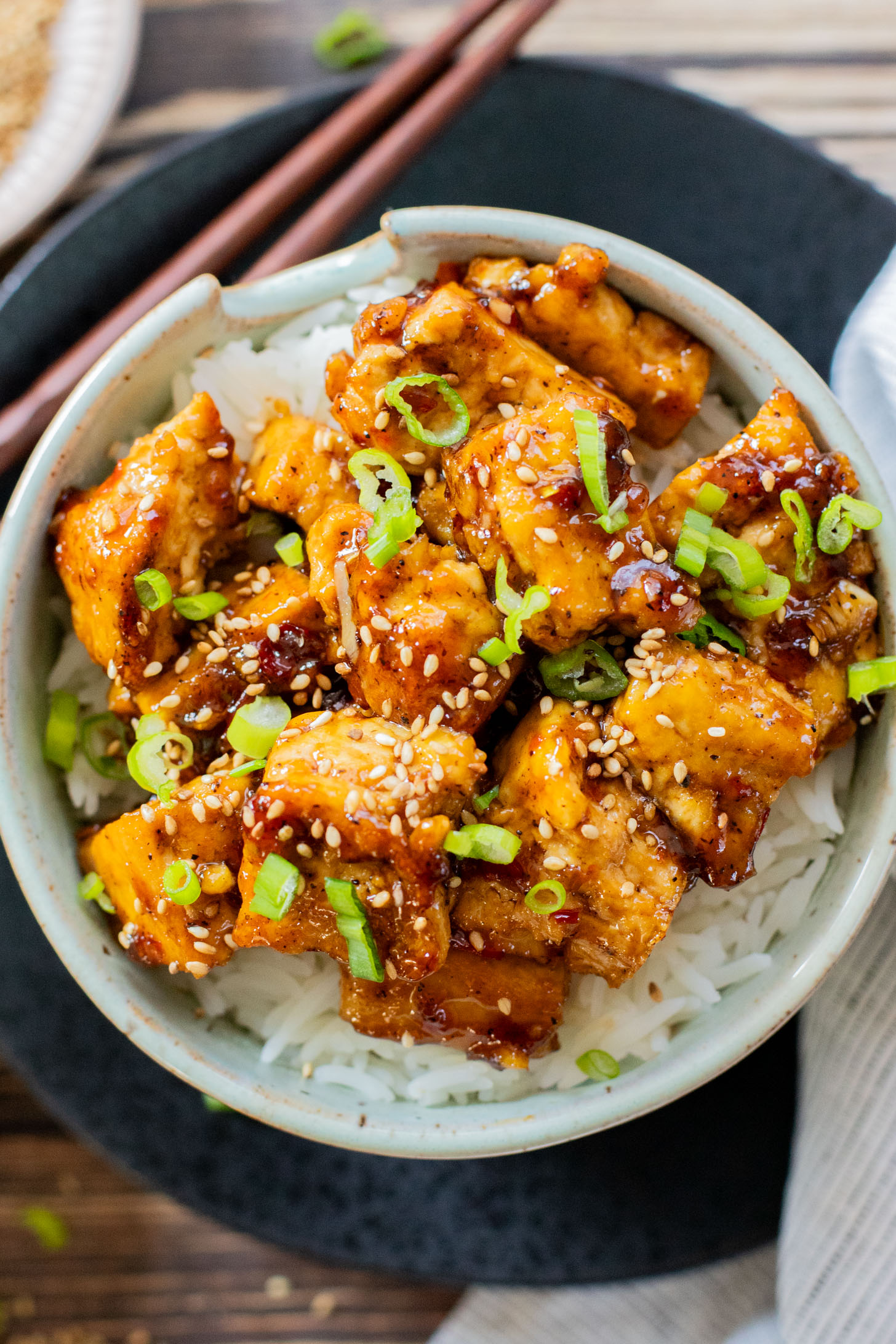 This Sweet Chili Tofu is a 20 minute dinner that is way better than takeout. The tofu is crispy and the sauce is delicious | ThisSavoryVegan.com
