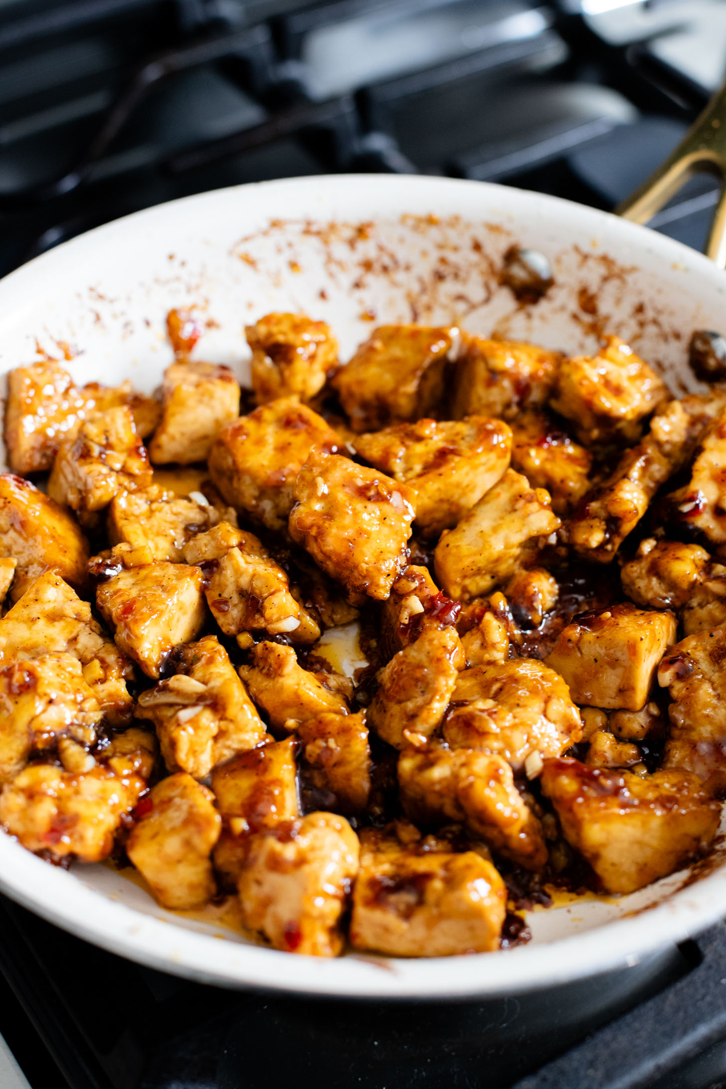 This Sweet Chili Tofu is a 20 minute dinner that is way better than takeout. The tofu is crispy and the sauce is delicious | ThisSavoryVegan.com