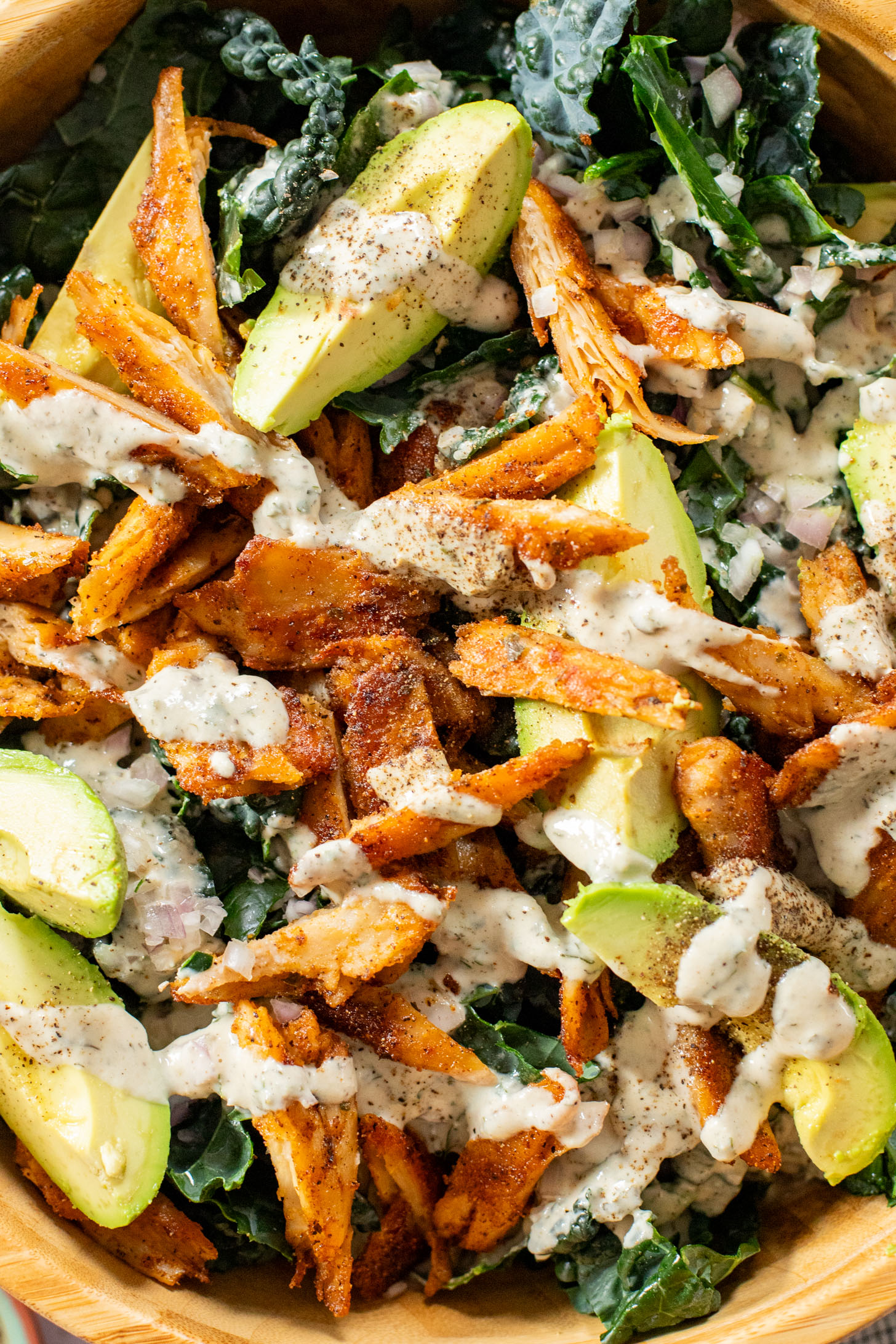 This Vegan Chicken Avocado Kale Salad is made with crisp veggies, charred vegan chicken and the best tahini ranch | ThisSavoryVegan.com