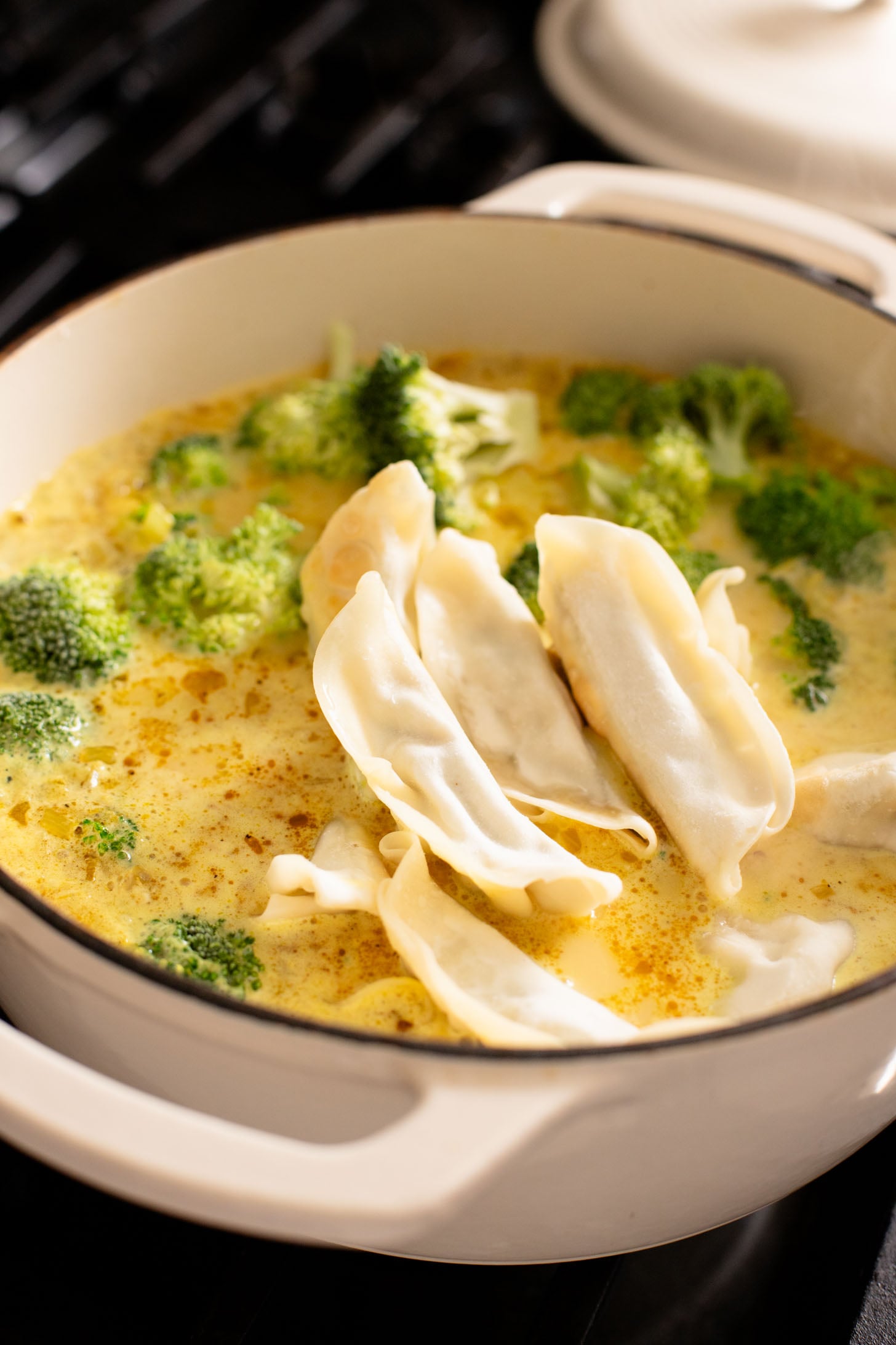 This Curried Coconut Wonton Soup has a dairy-free, creamy broth, plenty of veggies, rice noodles and vegan wontons | ThisSavoryVegan.com