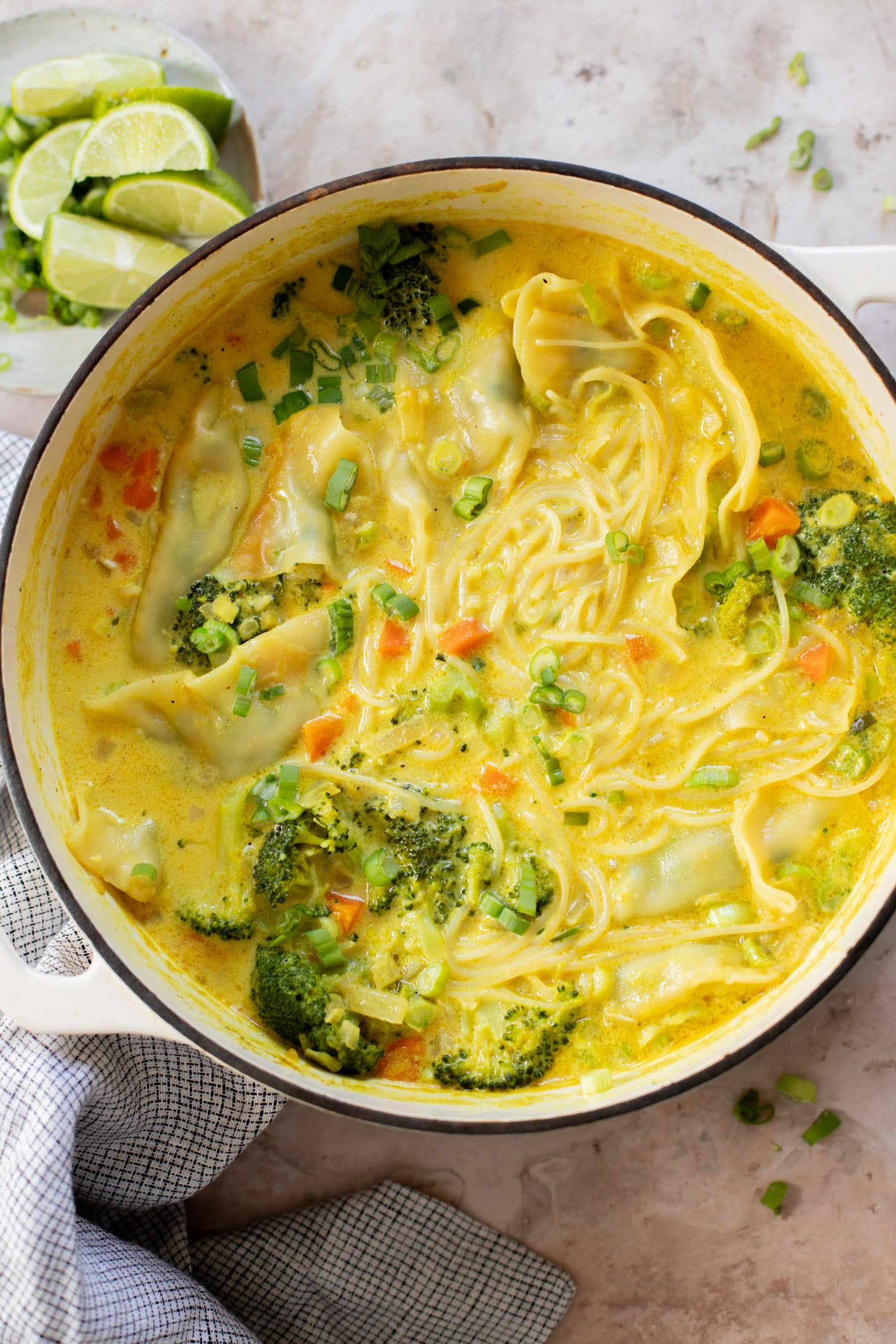 This Curried Coconut Wonton Soup has a dairy-free, creamy broth, plenty of veggies, rice noodles and vegan wontons | ThisSavoryVegan.com