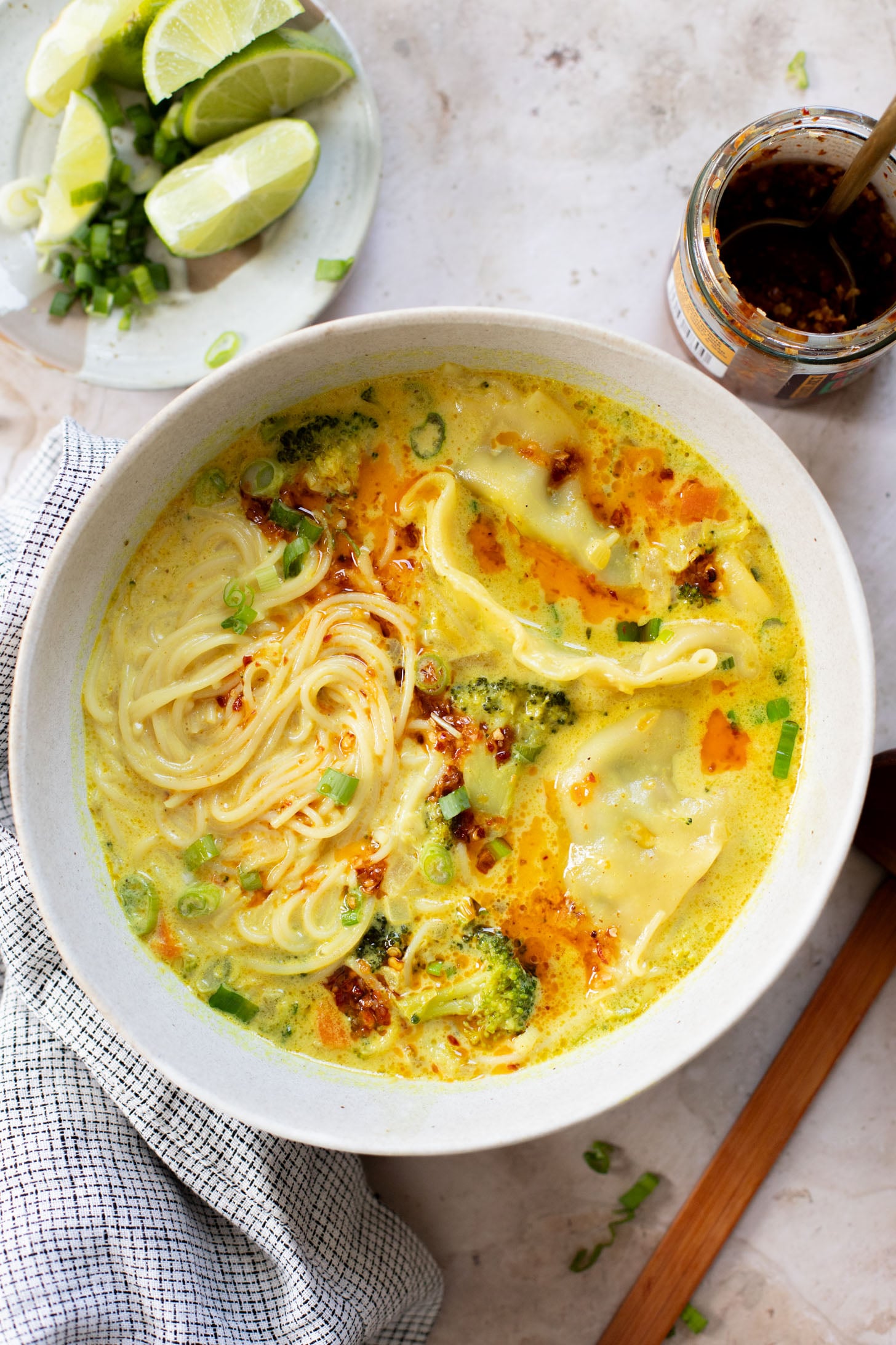 This Curried Coconut Wonton Soup has a dairy-free, creamy broth, plenty of veggies, rice noodles and vegan wontons | ThisSavoryVegan.com