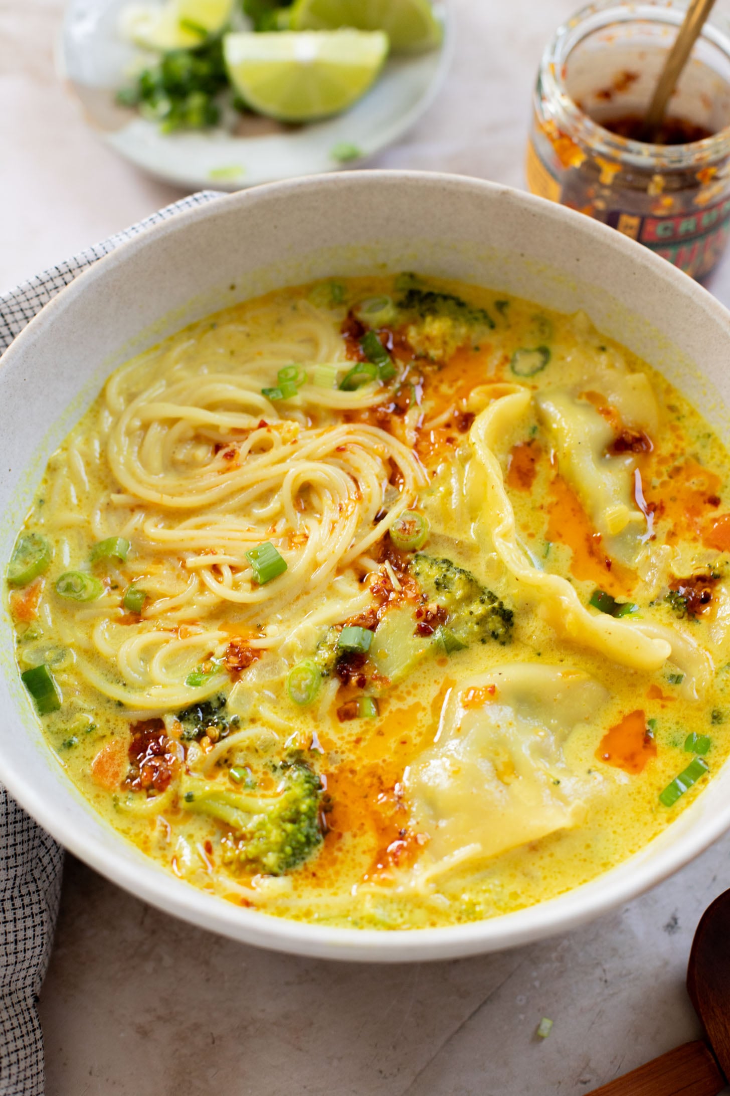 This Curried Coconut Wonton Soup has a dairy-free, creamy broth, plenty of veggies, rice noodles and vegan wontons | ThisSavoryVegan.com