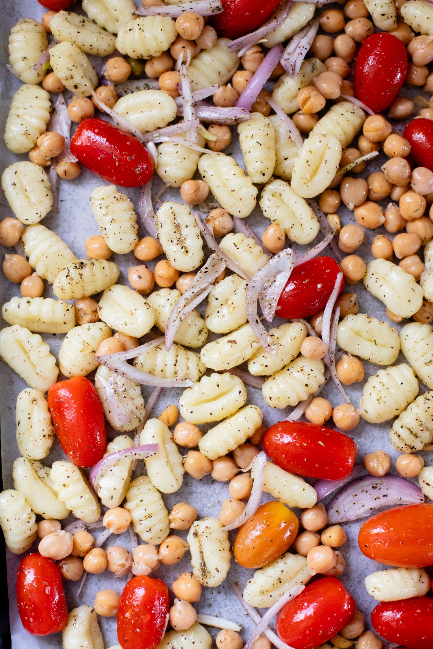 This Sheet Pan Gnocchi & Chickpeas recipe is perfect for a weeknight dinner. Everything is made on one baking sheet and is ready in 30 minutes | ThisSavoryVegan.com