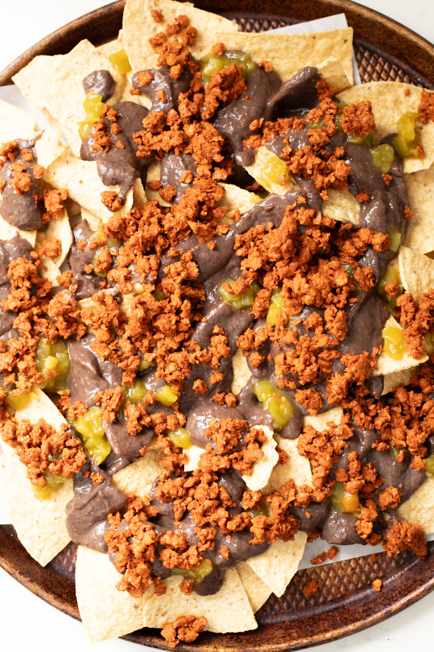 Get game day ready with these Soy Chorizo & Black Bean Nachos! These are the ultimate vegan nachos that everyone will love | ThisSavoryVegan.com