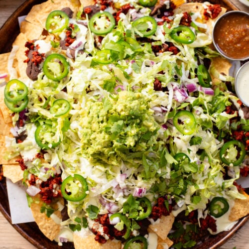 Get game day ready with these Soy Chorizo & Black Bean Nachos! These are the ultimate vegan nachos that everyone will love | ThisSavoryVegan.com