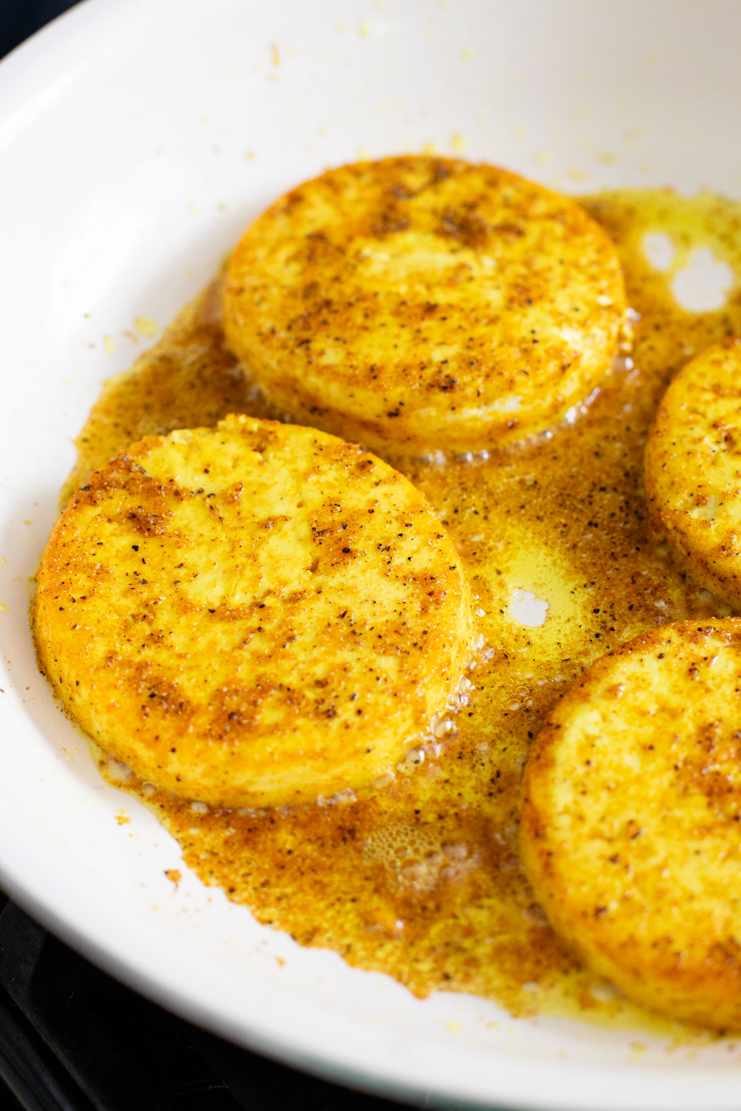 These Tofu Breakfast Sandwiches are the perfect breakfast on the go. Layered with seasoned tofu, tempeh bacon and spinach | ThisSavoryVegan.com