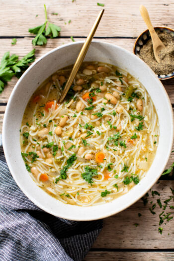 This White Bean Noodle Soup is the perfect swap for chicken noodle soup! It is 100% vegan and great when you want something cozy & comforting | ThisSavoryVegan.com