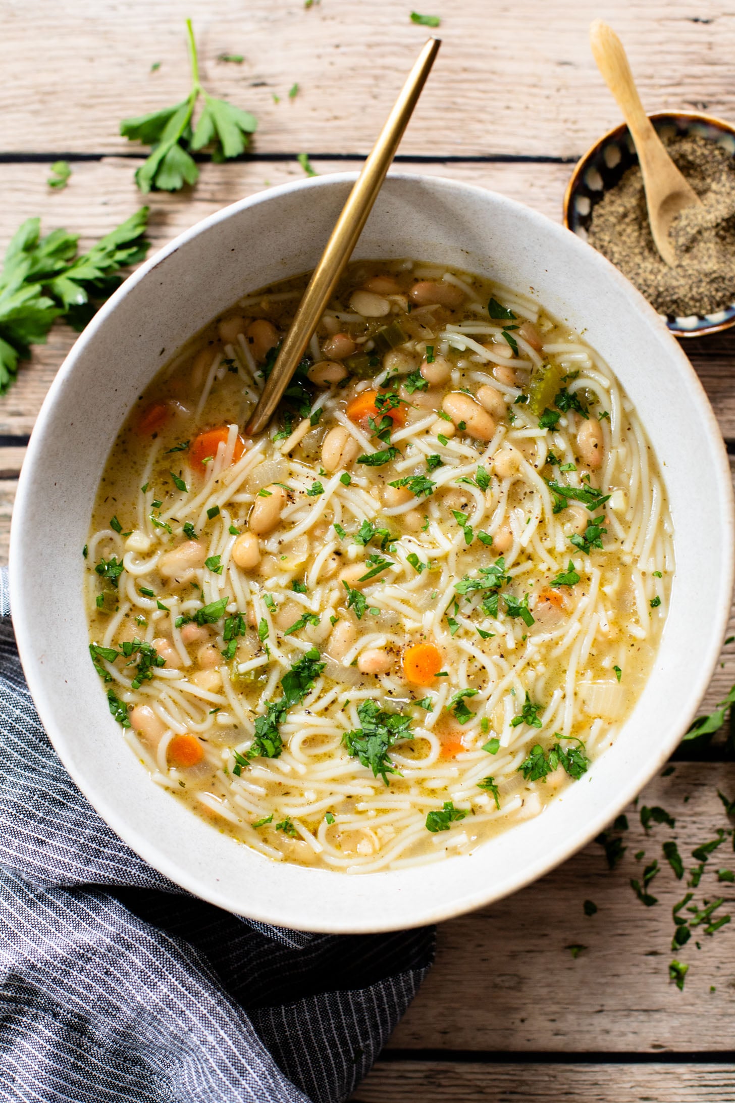This White Bean Noodle Soup is the perfect swap for chicken noodle soup! It is 100% vegan and great when you want something cozy & comforting | ThisSavoryVegan.com