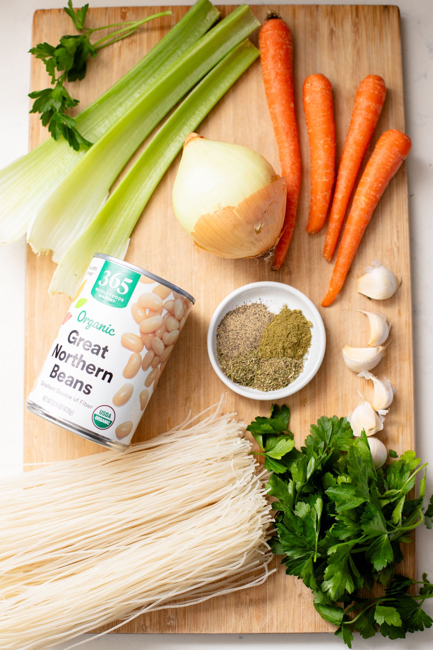 This White Bean Noodle Soup is the perfect swap for chicken noodle soup! It is 100% vegan and great when you want something cozy & comforting | ThisSavoryVegan.com