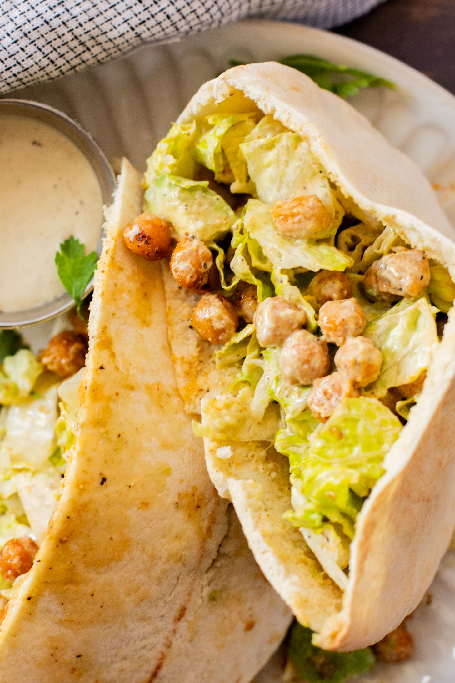 These Chickpea Caesar Salad Pitas are the perfect quick lunch or dinner! Made with the BEST dairy-free Caesar dressing | ThisSavoryVegan.com