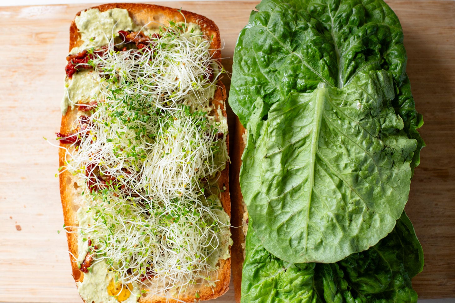 These Pesto Chickpea Salad Sandwiches are easy, filling and so tasty! Layered with so many delicious flavors | ThisSavoryVegan.com