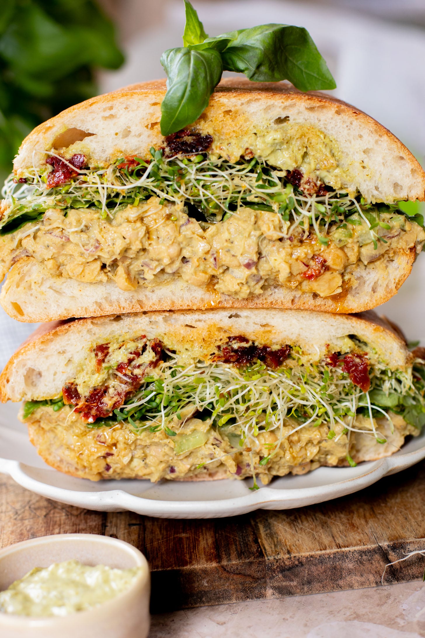 These Pesto Chickpea Salad Sandwiches are easy, filling and so tasty! Layered with so many delicious flavors | ThisSavoryVegan.com