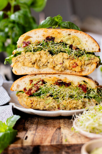 These Pesto Chickpea Salad Sandwiches are easy, filling and so tasty! Layered with so many delicious flavors | ThisSavoryVegan.com