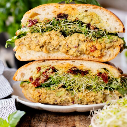 These Pesto Chickpea Salad Sandwiches are easy, filling and so tasty! Layered with so many delicious flavors | ThisSavoryVegan.com