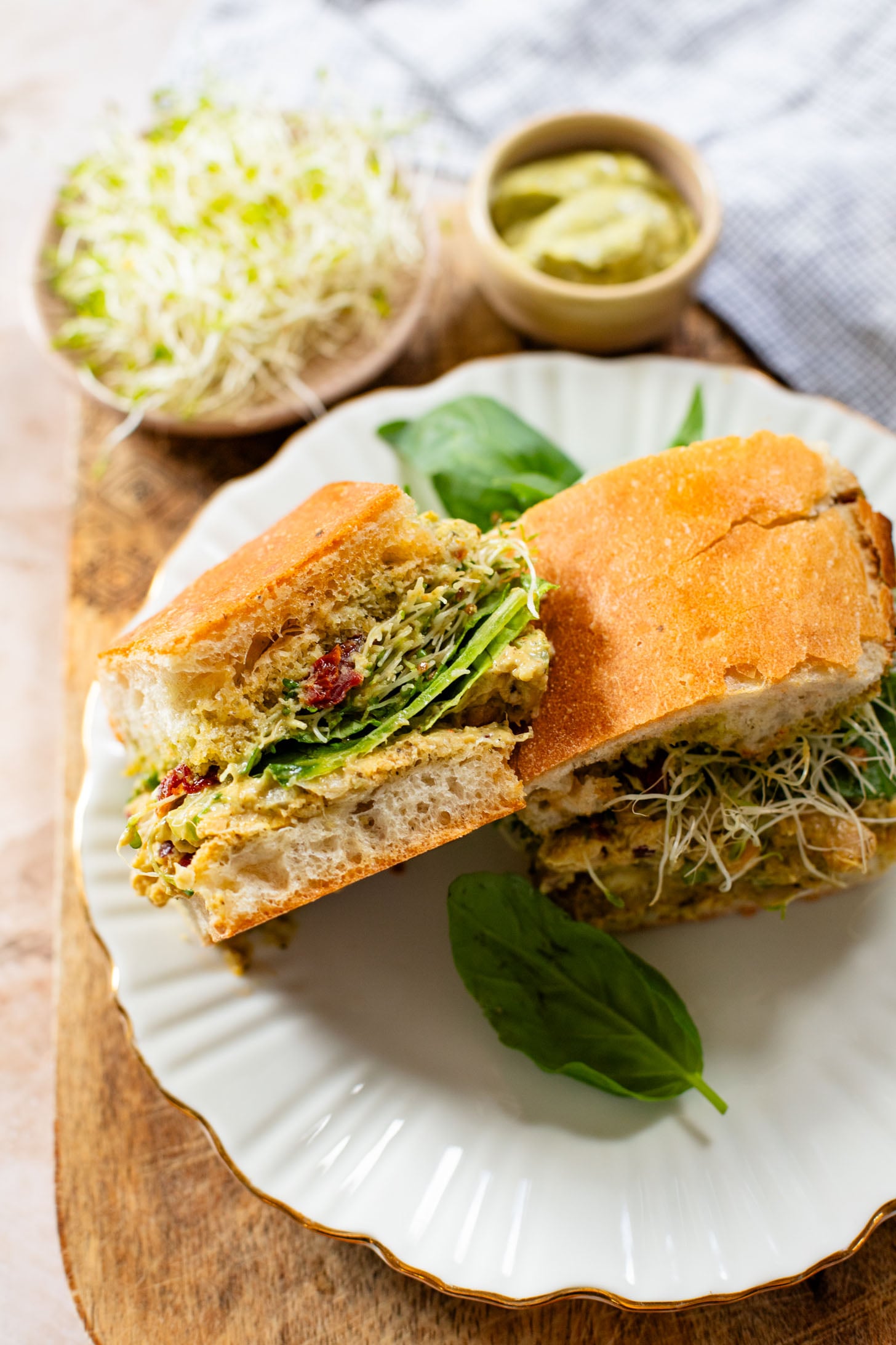 These Pesto Chickpea Salad Sandwiches are easy, filling and so tasty! Layered with so many delicious flavors | ThisSavoryVegan.com