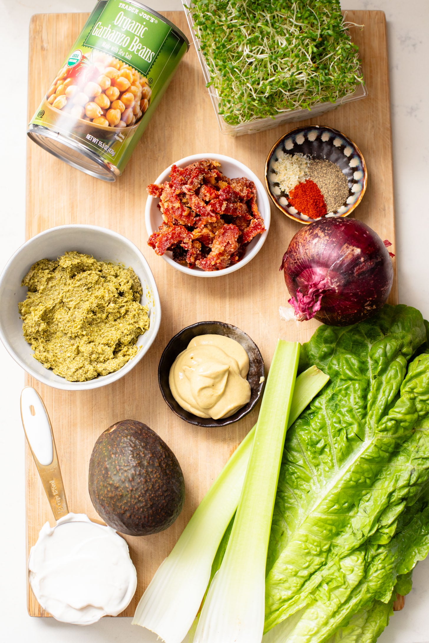 These Pesto Chickpea Salad Sandwiches are easy, filling and so tasty! Layered with so many delicious flavors | ThisSavoryVegan.com