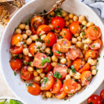 This Tomato & Chickpea Salad is a bright & fresh salad recipe that is perfect for a quick lunch! Best served with toasted bread | ThisSavoryVegan.com