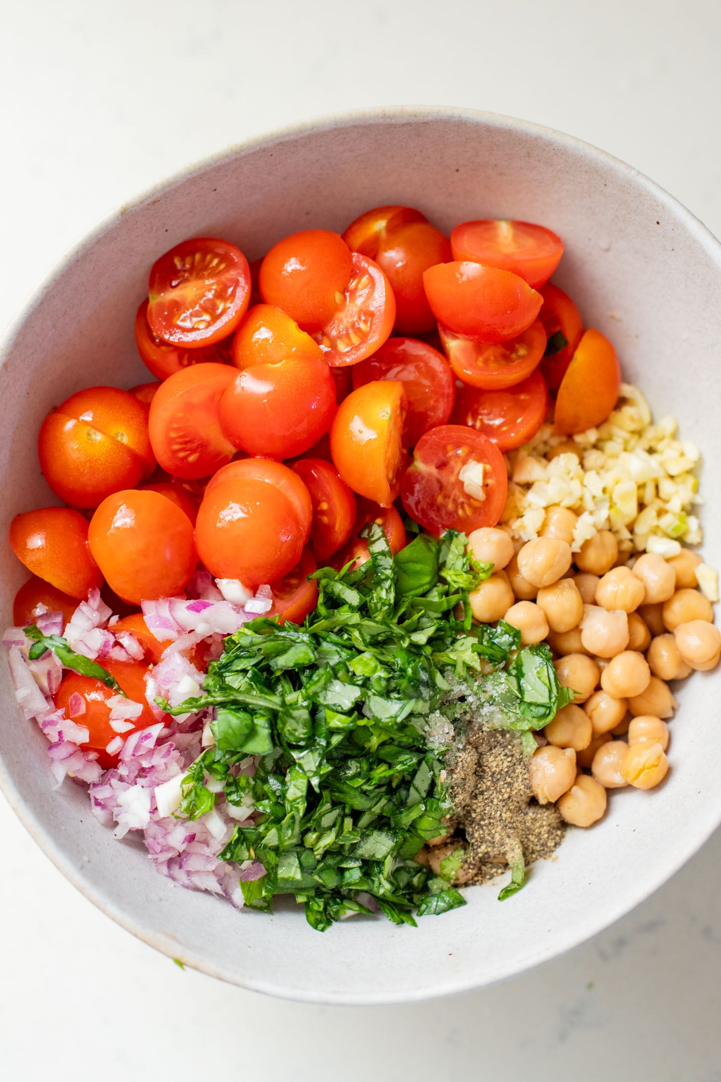 This Tomato & Chickpea Salad is a bright & fresh salad recipe that is perfect for a quick lunch! Best served with toasted bread | ThisSavoryVegan.com