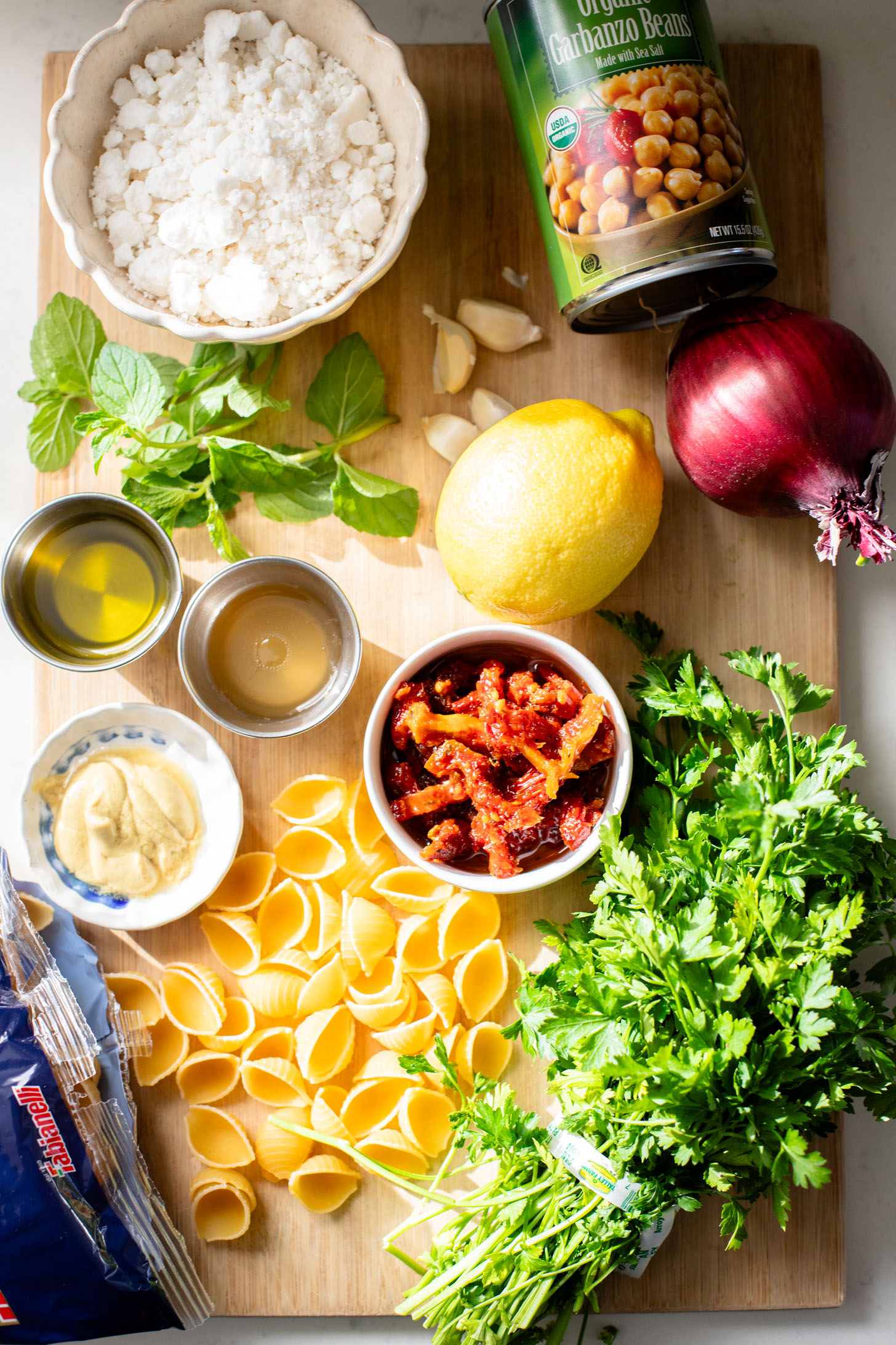 This Vegan Feta & Chickpea Pasta Salad is the perfect salad for spring. Light, bright and super yummy | ThisSavoryVegan.com