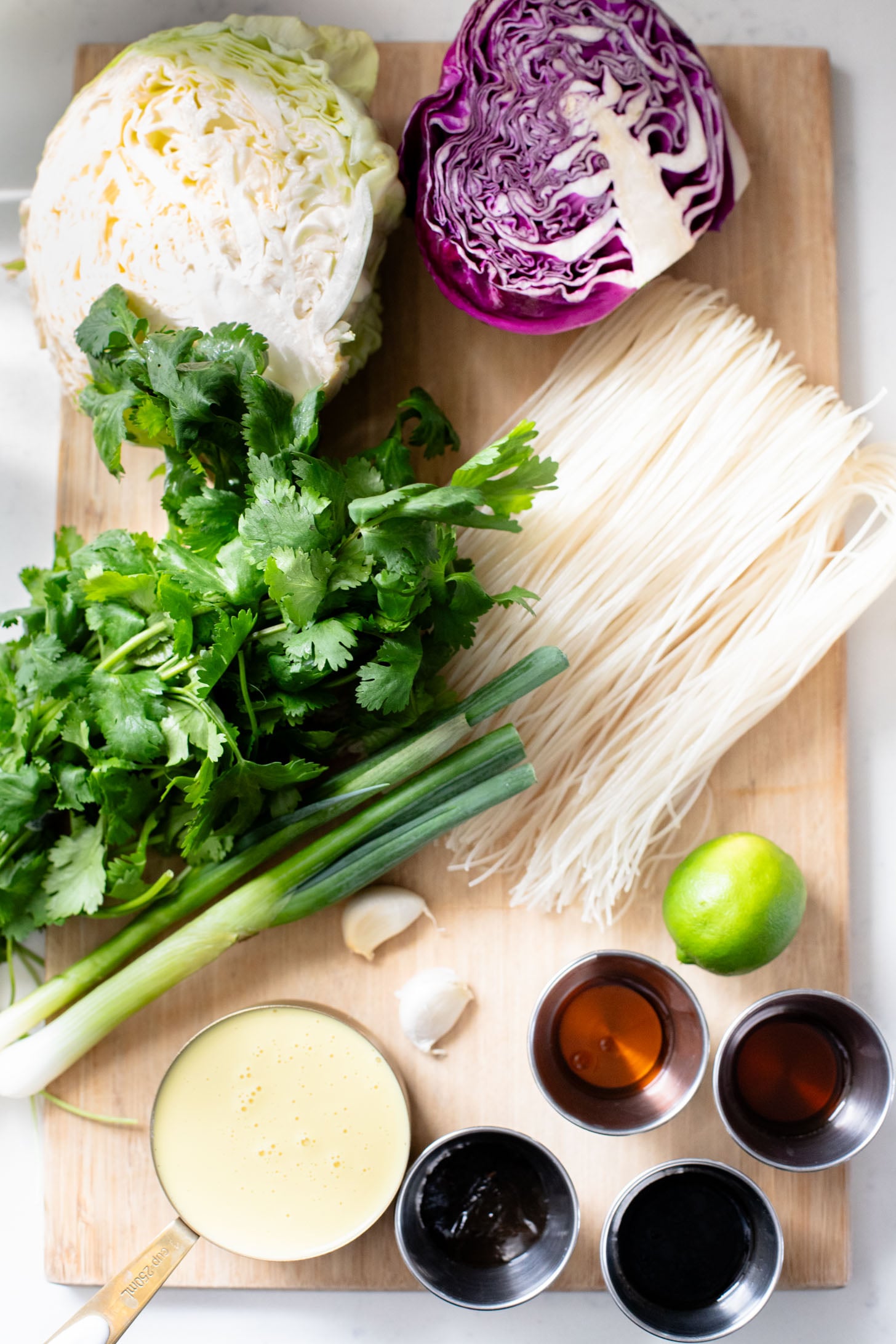 This Cabbage and Rice Noodle Stir-Fry is great for a weeknight when you are short on time for dinner. Noddles, veggies & vegan eggs for protein | ThisSavoryVegan.com