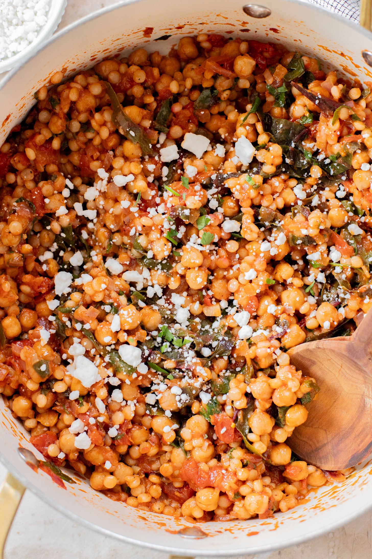 This Chickpea Couscous Skillet is a quick and healthy vegan dinner with a delicious tomato sauce, rainbow chard, pearl couscous & chickpeas | ThisSavoryVegan.com